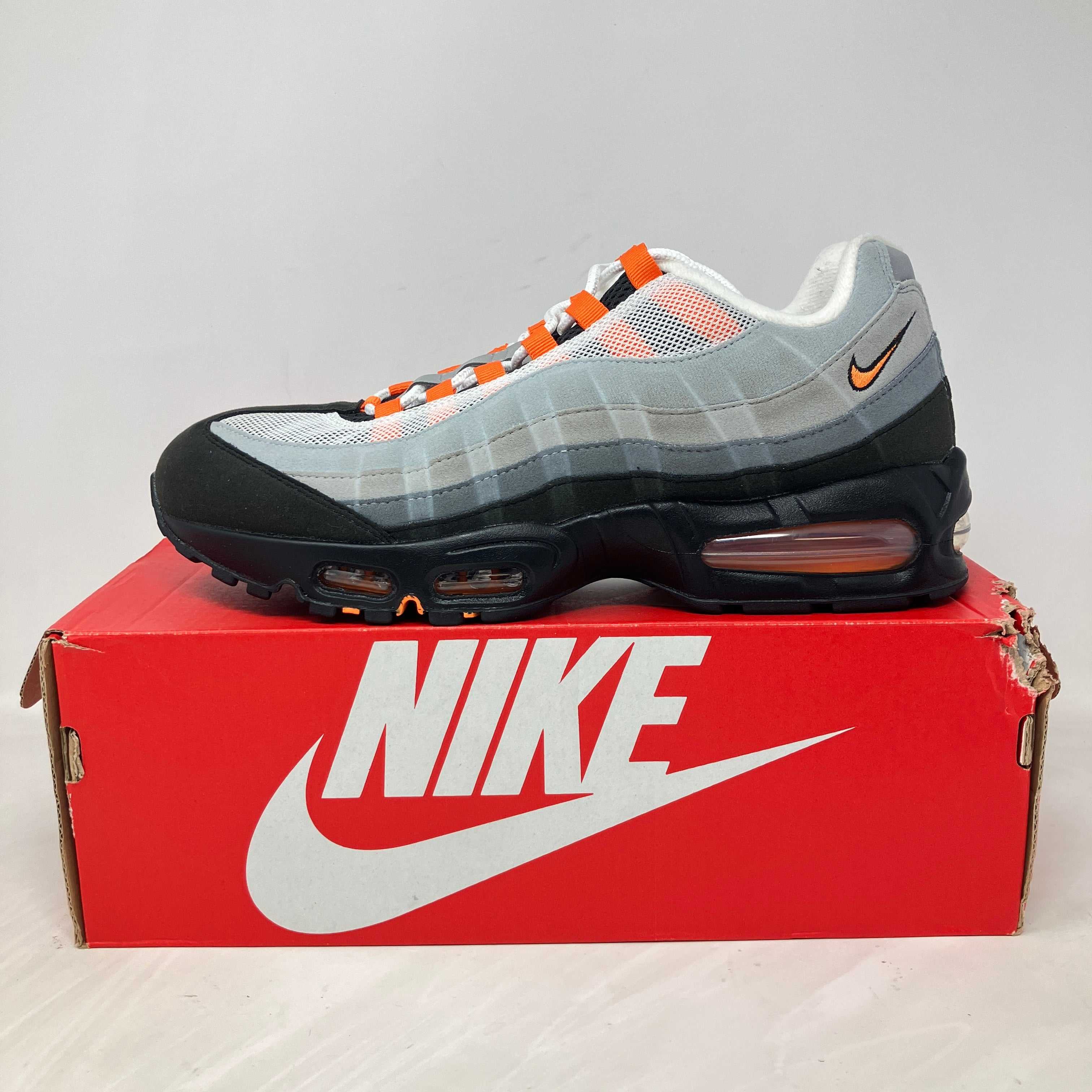Nike Air Max 95 OG Big Bubble Bright Mandarin sneaker on red Nike box