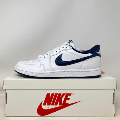 White and metallic blue Jordan 1 Retro Low sneaker on Nike box, brand new with accessories included