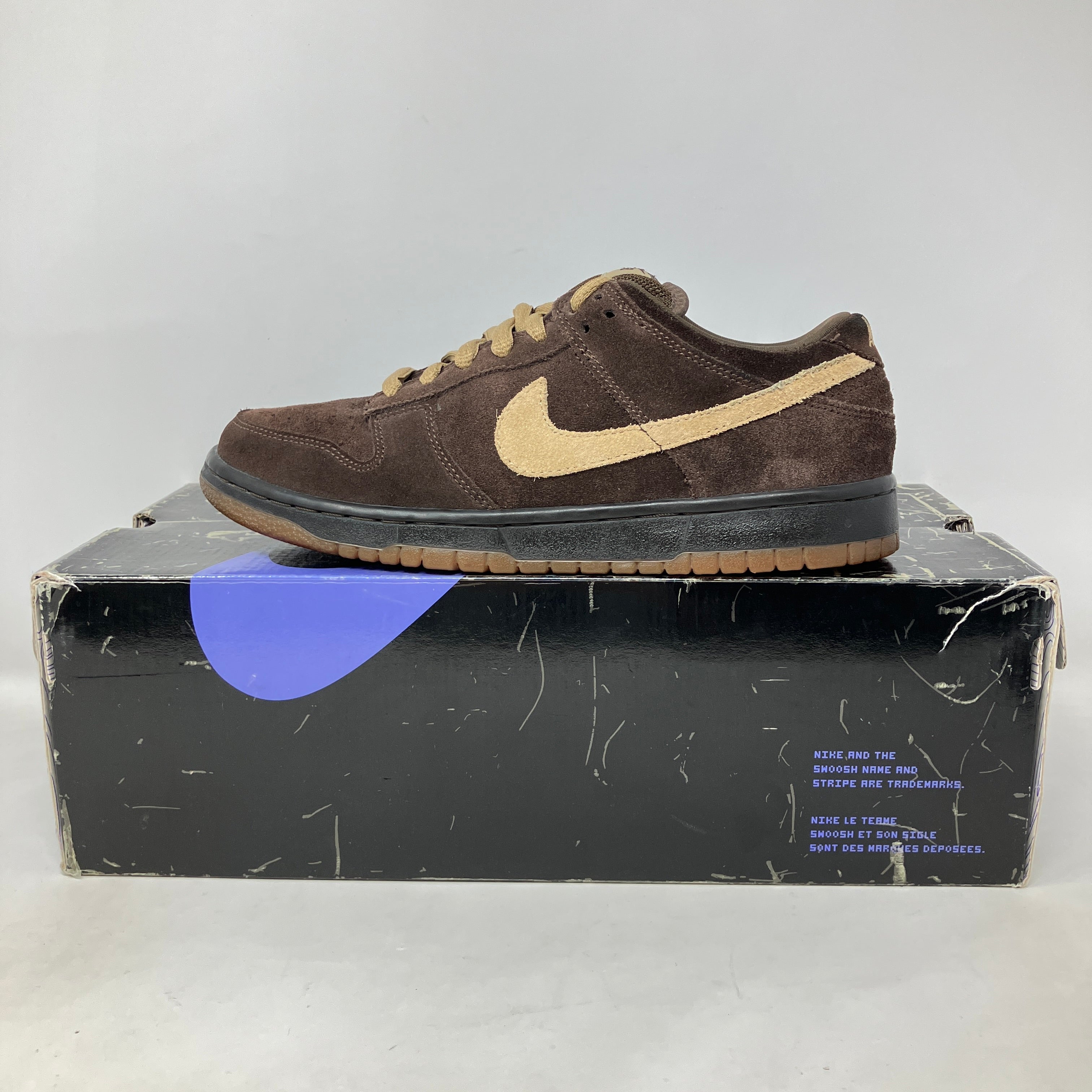 Nike Dunk Low Pro Sb Dark Mocha/Tweed brown suede sneaker on black box, pre-owned condition
