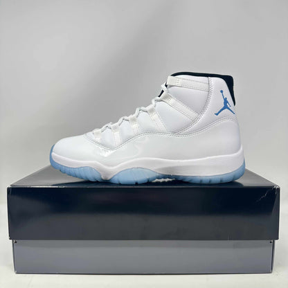 Jordan 11 Retro Legend Blue 2024 sneaker in white with blue accents on black and gray box