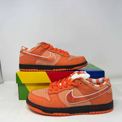 Nike SB Dunk Low Concepts Orange Lobster sneakers, pre-owned, with original accessories minus rubber bands.