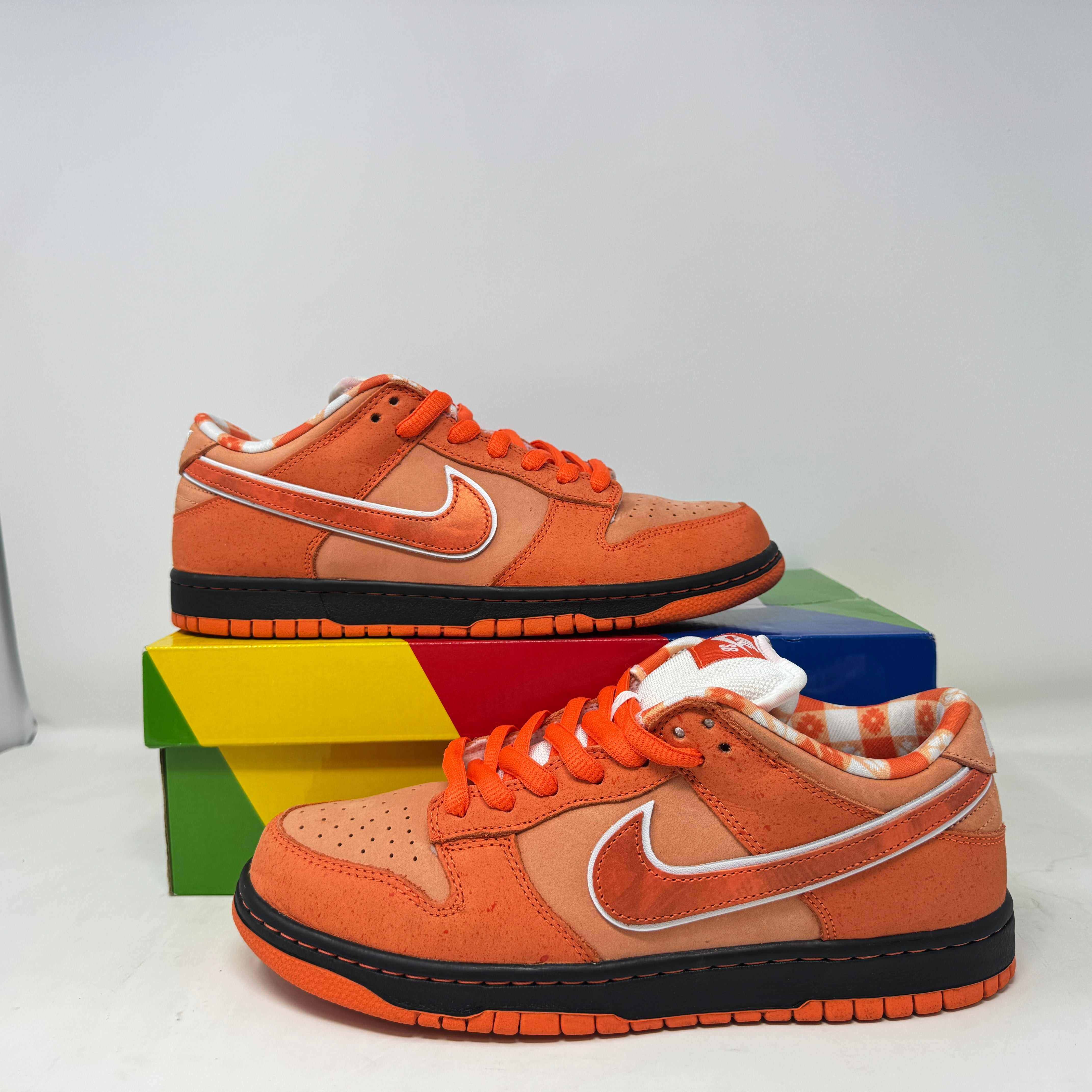Nike SB Dunk Low Concepts Orange Lobster sneakers, pre-owned, with original accessories minus rubber bands.