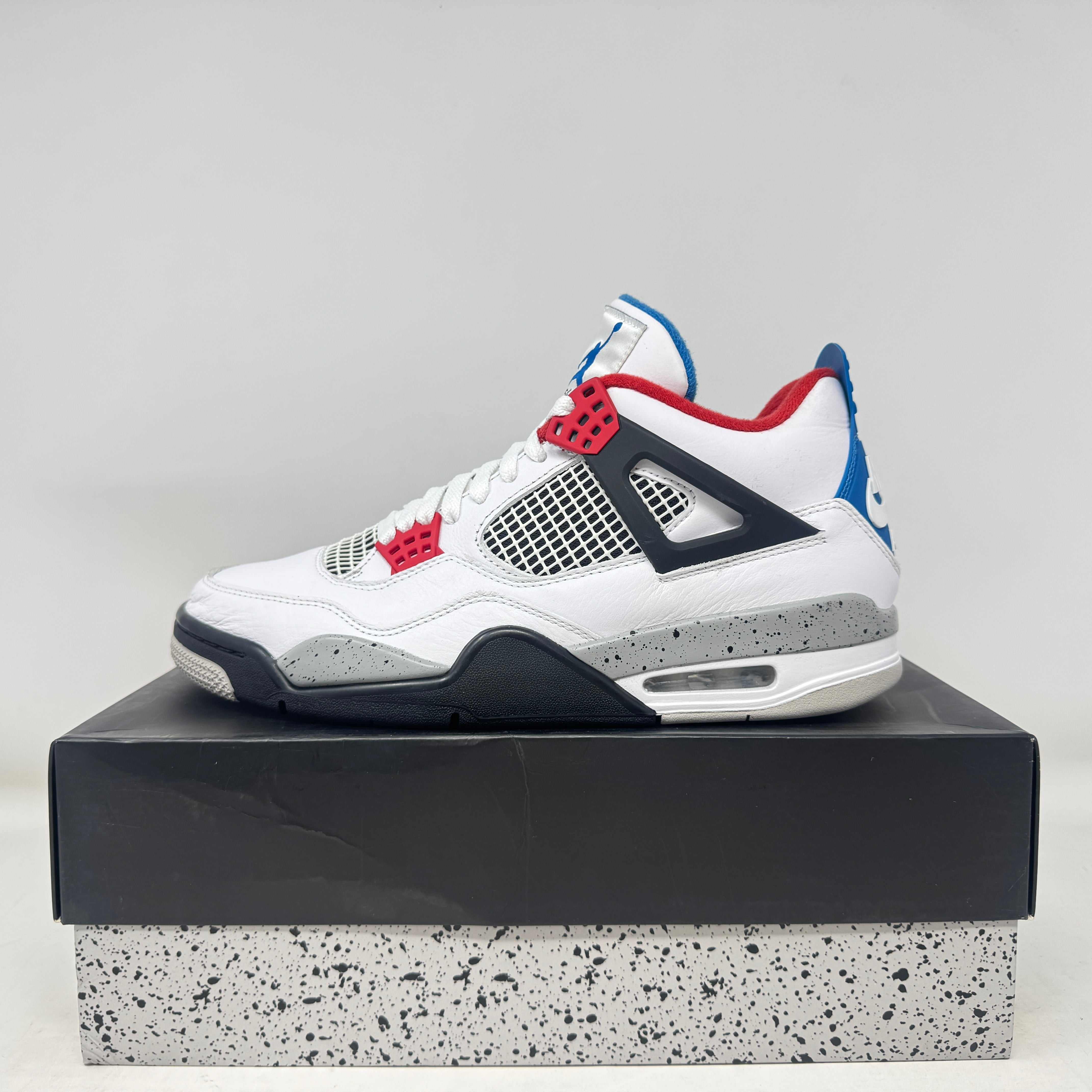 Pre-owned Jordan 4 Retro What The sneaker with red, blue, and grey accents on box