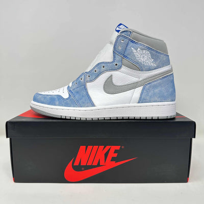 Jordan 1 Retro High sneaker in white and light blue suede with grey leather Swoosh, perforated toe and high padded collar.