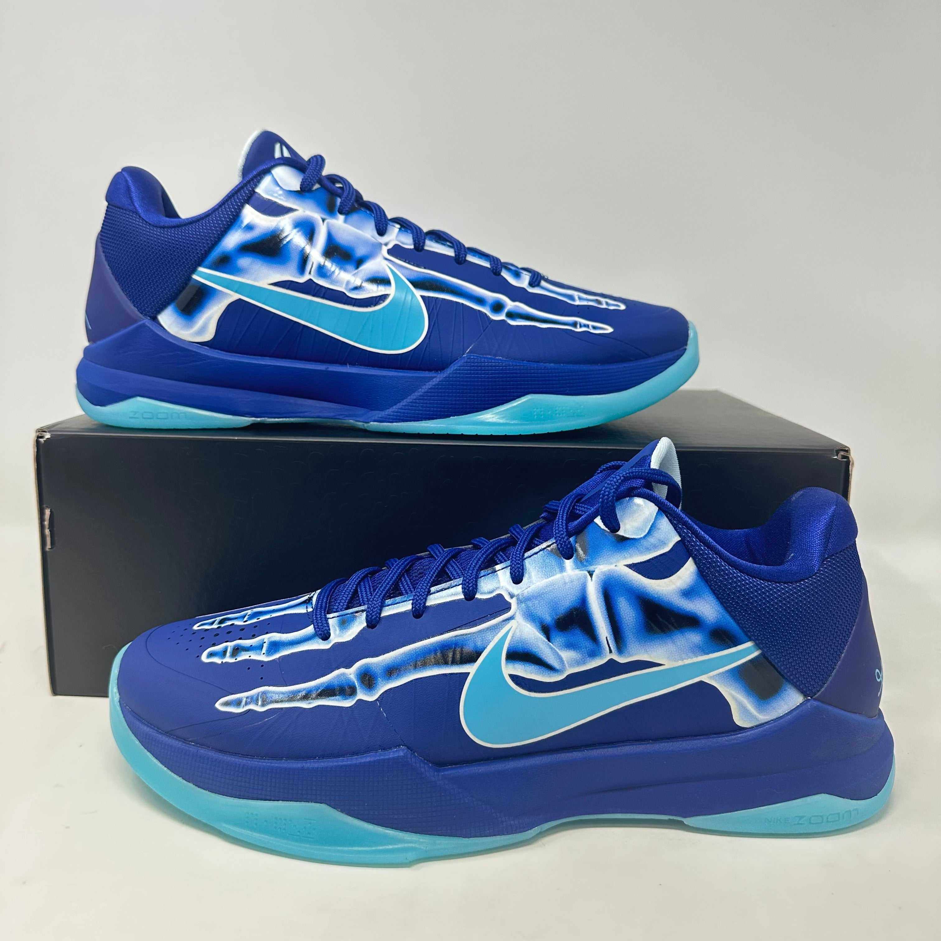 Nike Kobe 5 Protro X-Ray sneakers in blue with x-ray graphic design, brand new condition.