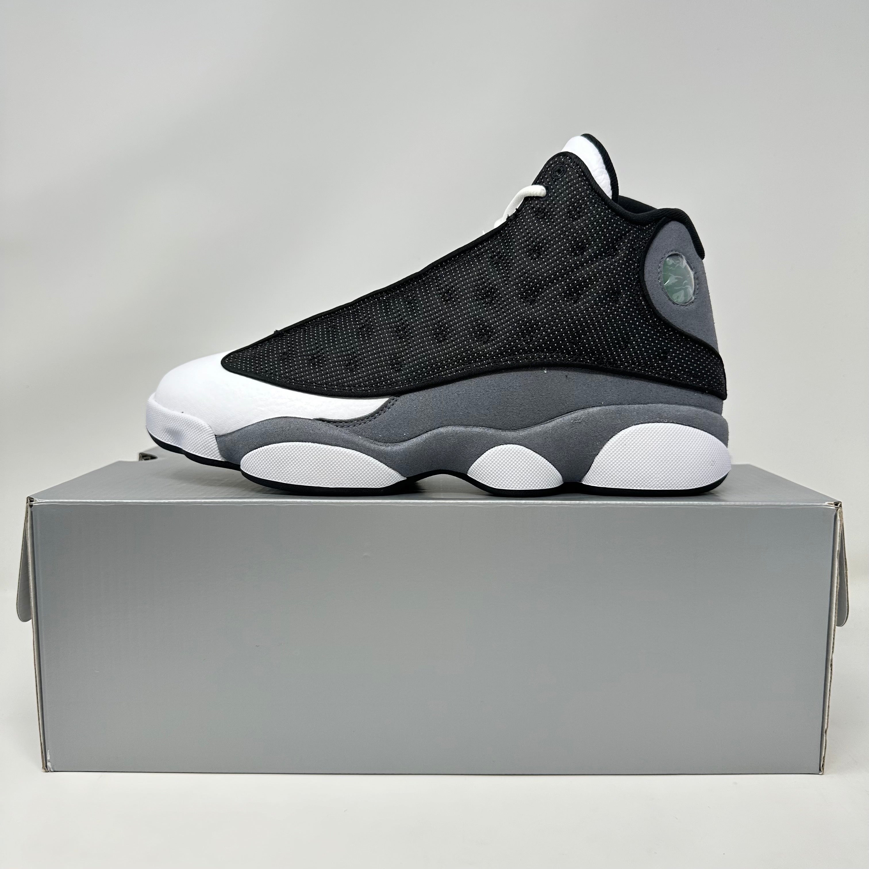 Jordan 13 Retro Black Flint sneaker brand new on gray box with all accessories included