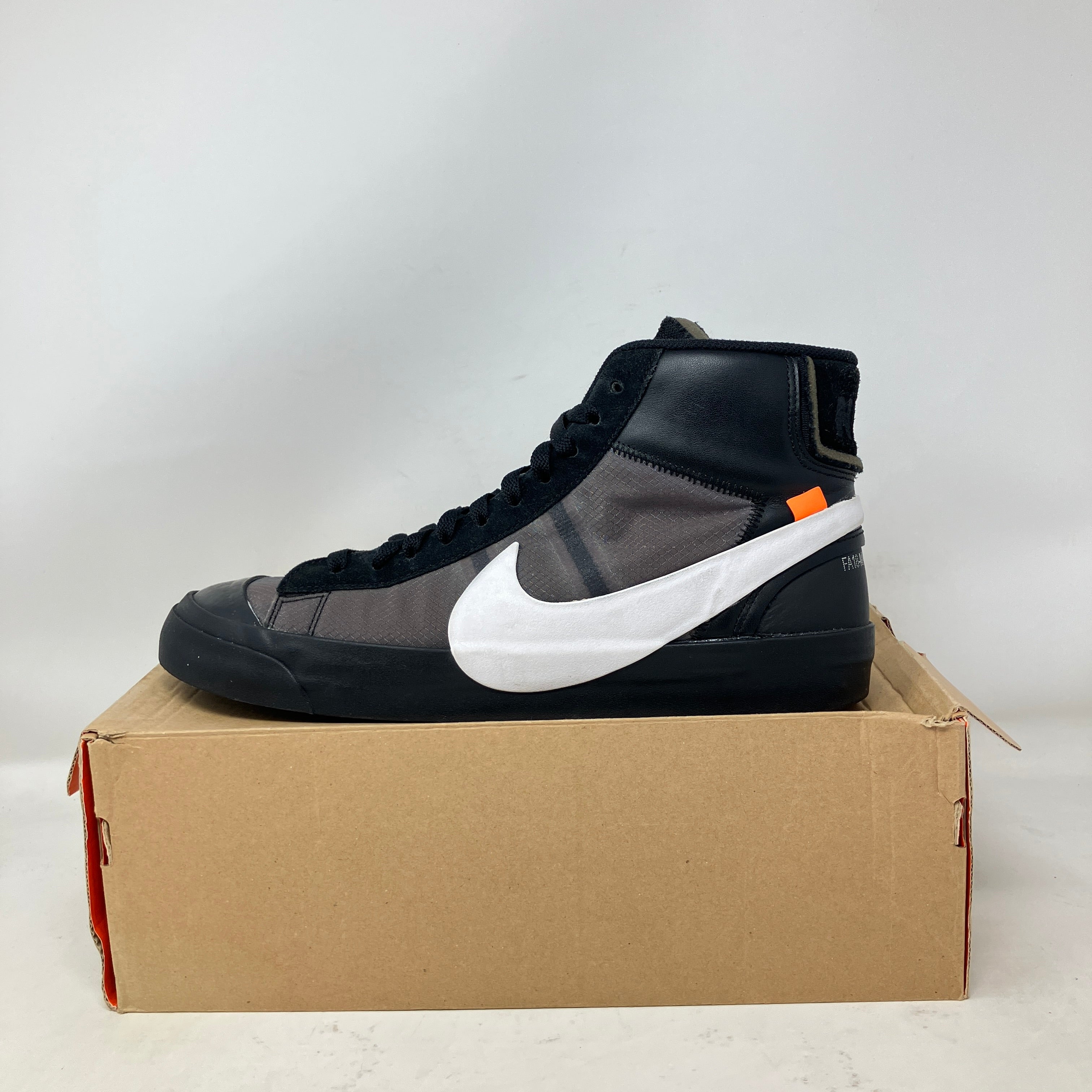 Nike Blazer Mid Off-White Grim Reaper black sneaker with white swoosh on replacement box, pre-owned condition