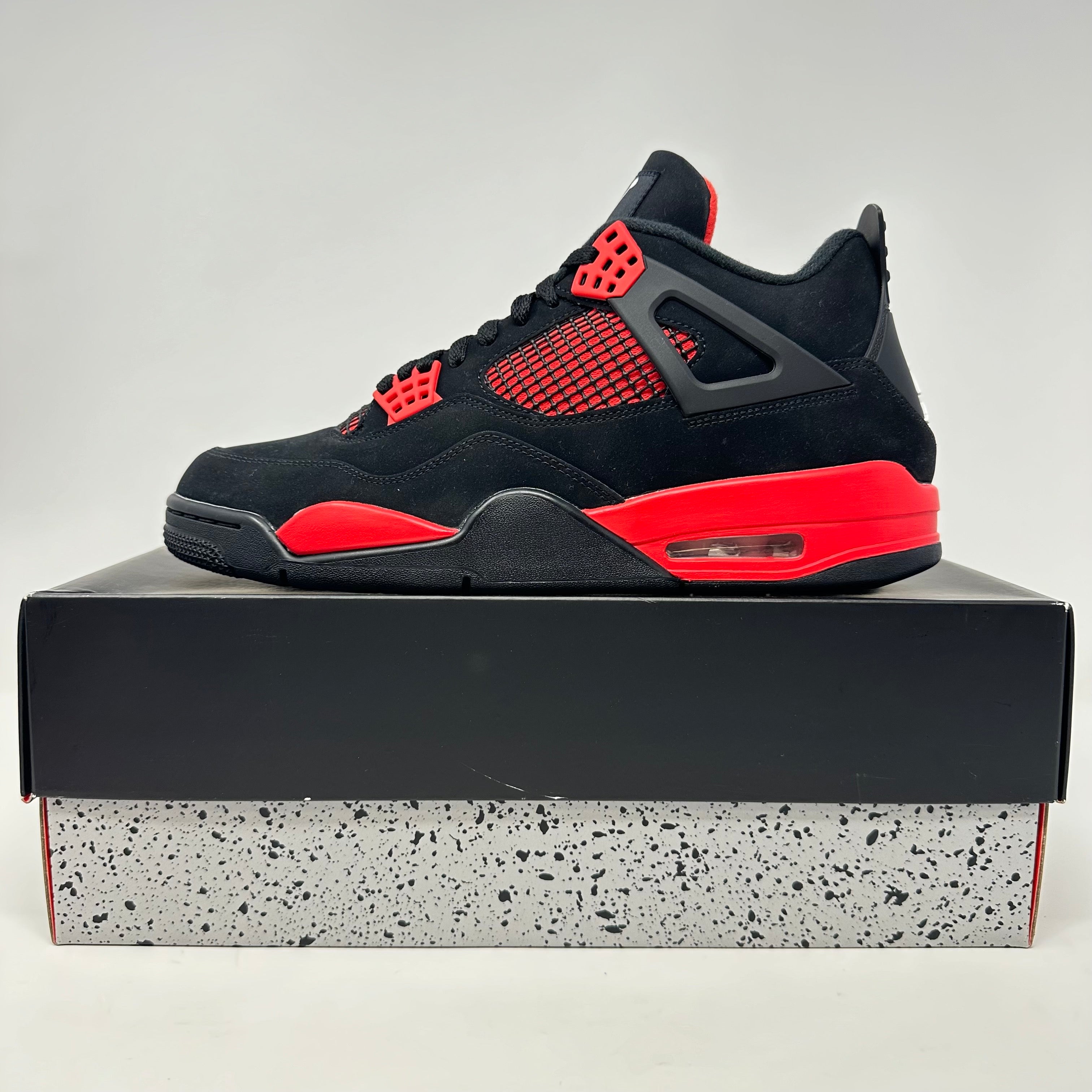Jordan 4 Retro Red Thunder sneakers, brand new with all accessories included.