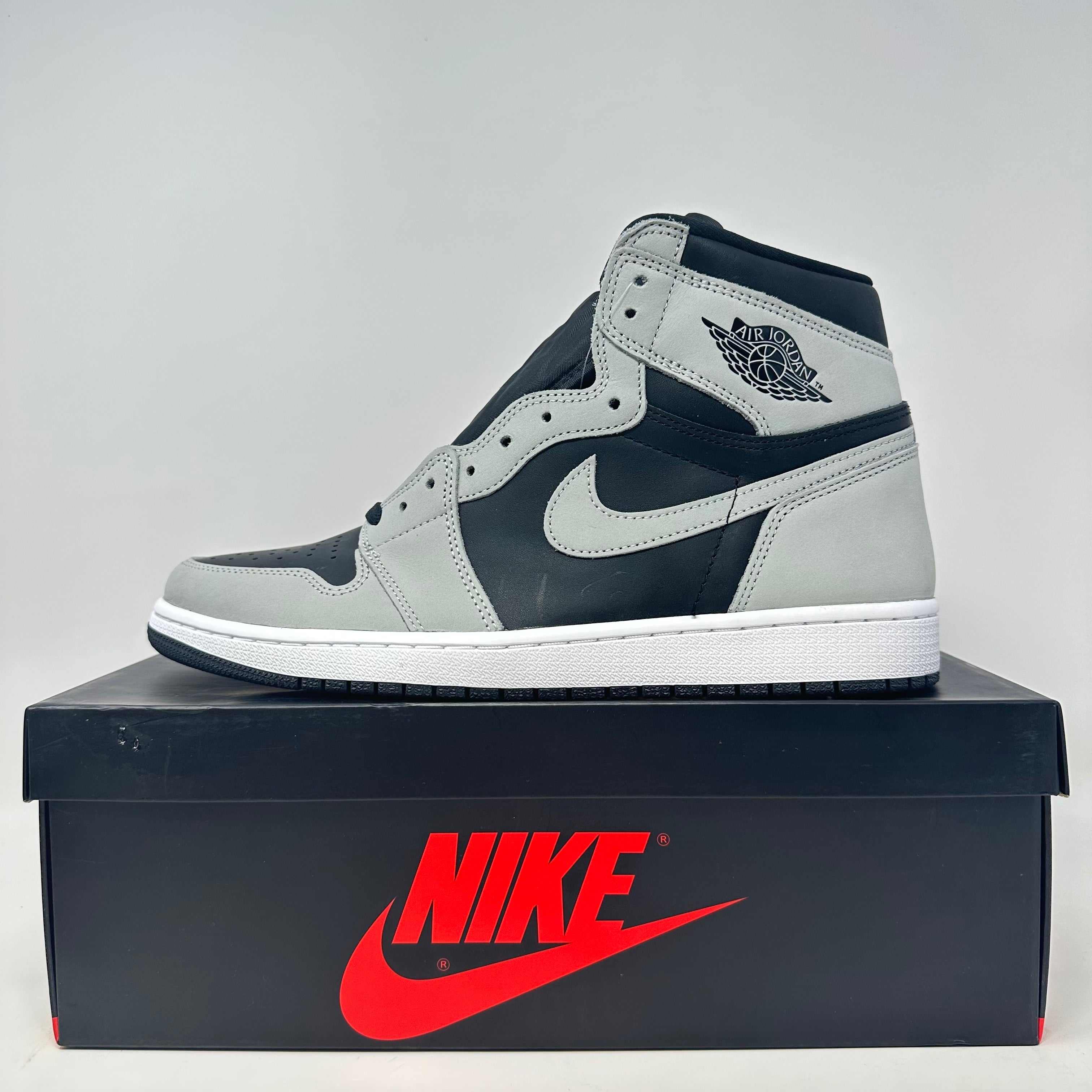 Jordan 1 Retro High Shadow 2.0 sneaker in black and gray on Nike box, brand new with all accessories included