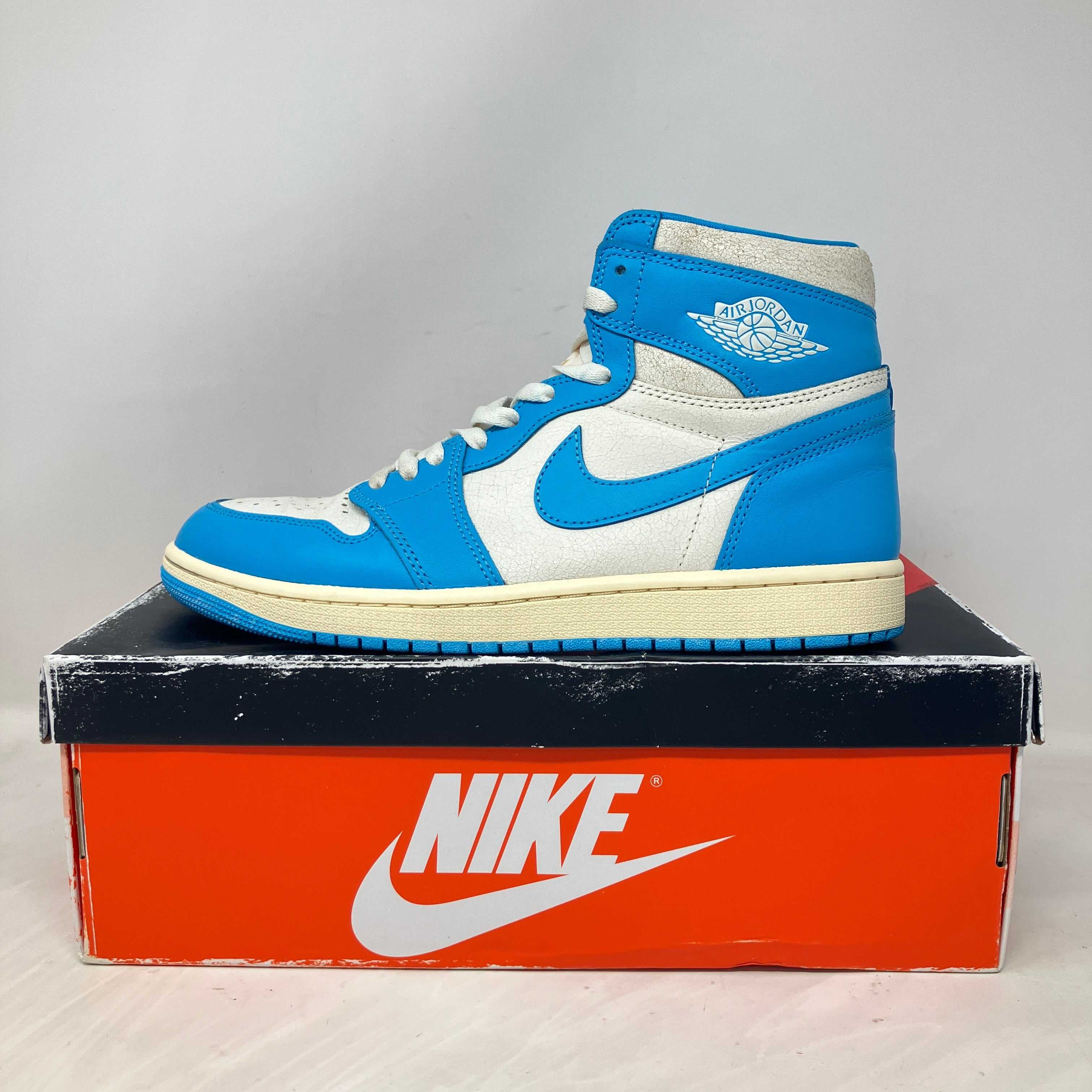 Pre-owned Jordan 1 Retro High OG UNC Reimagined sneaker on Nike box with accessories included
