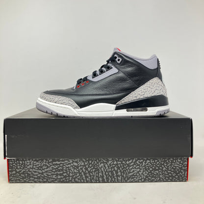 Side view of pre-owned Jordan 3 Retro OG Black Cement 2024 sneaker on box with accessories included