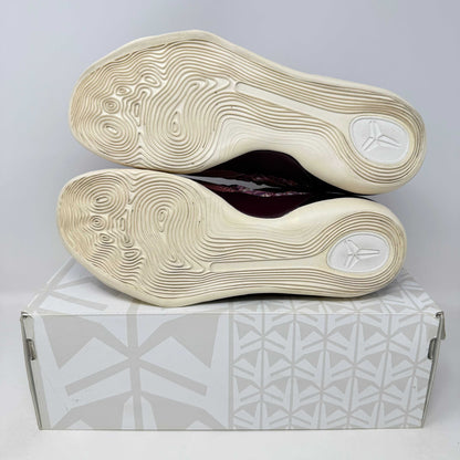 Nike Kobe 9 EM Low Silk sneakers, pre-owned, with original box and accessories included.