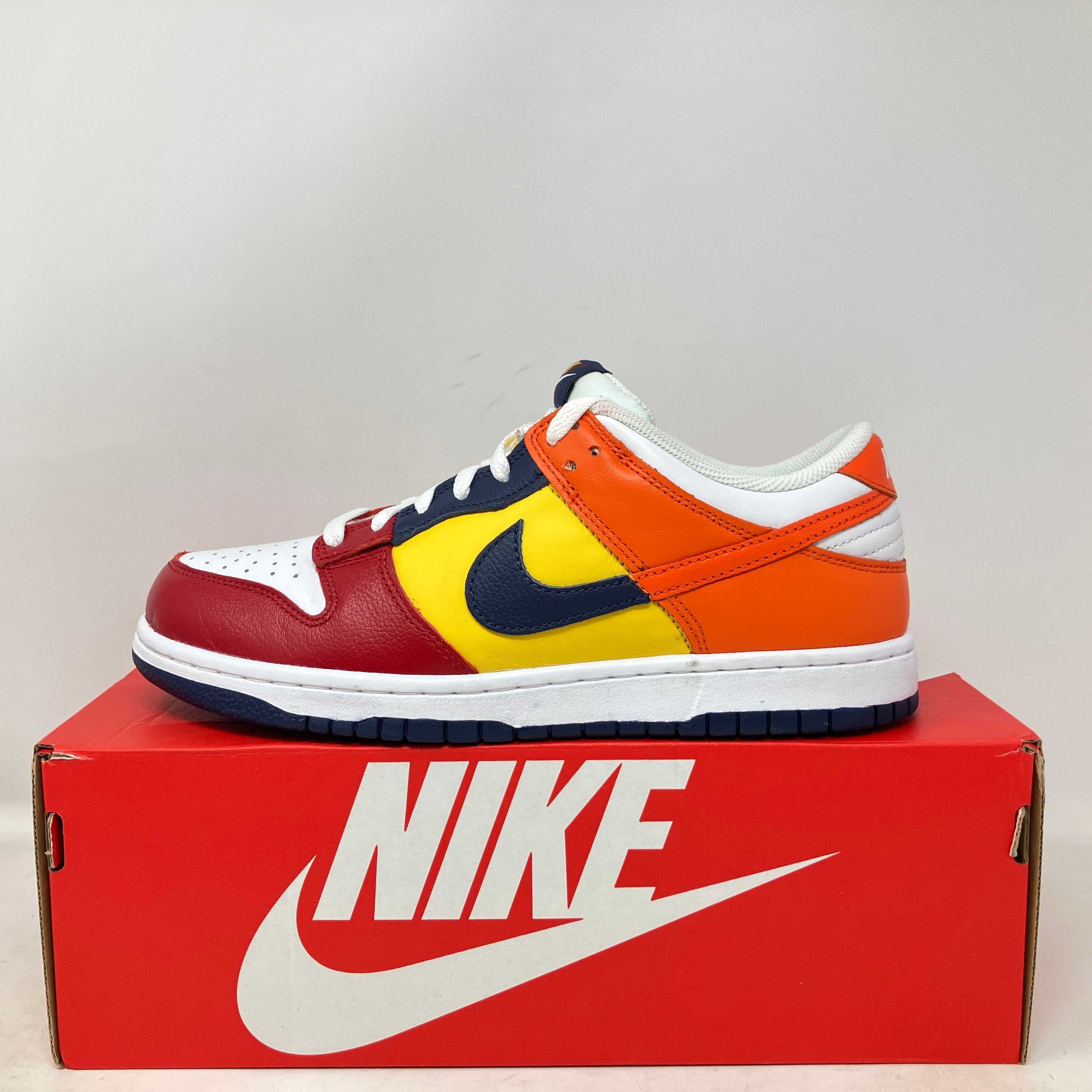 Nike Dunk Low QS CO.JP What The 2024 multicolor sneaker on red Nike box pre-owned with accessories
