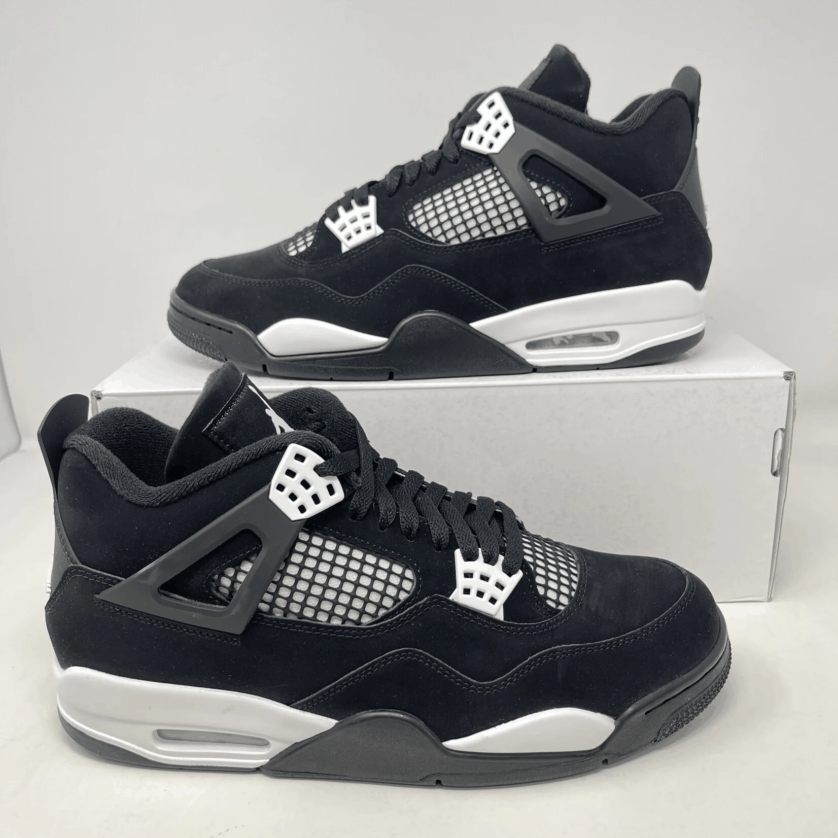 Brand new Jordan 4 Retro White Thunder sneakers with included accessories.