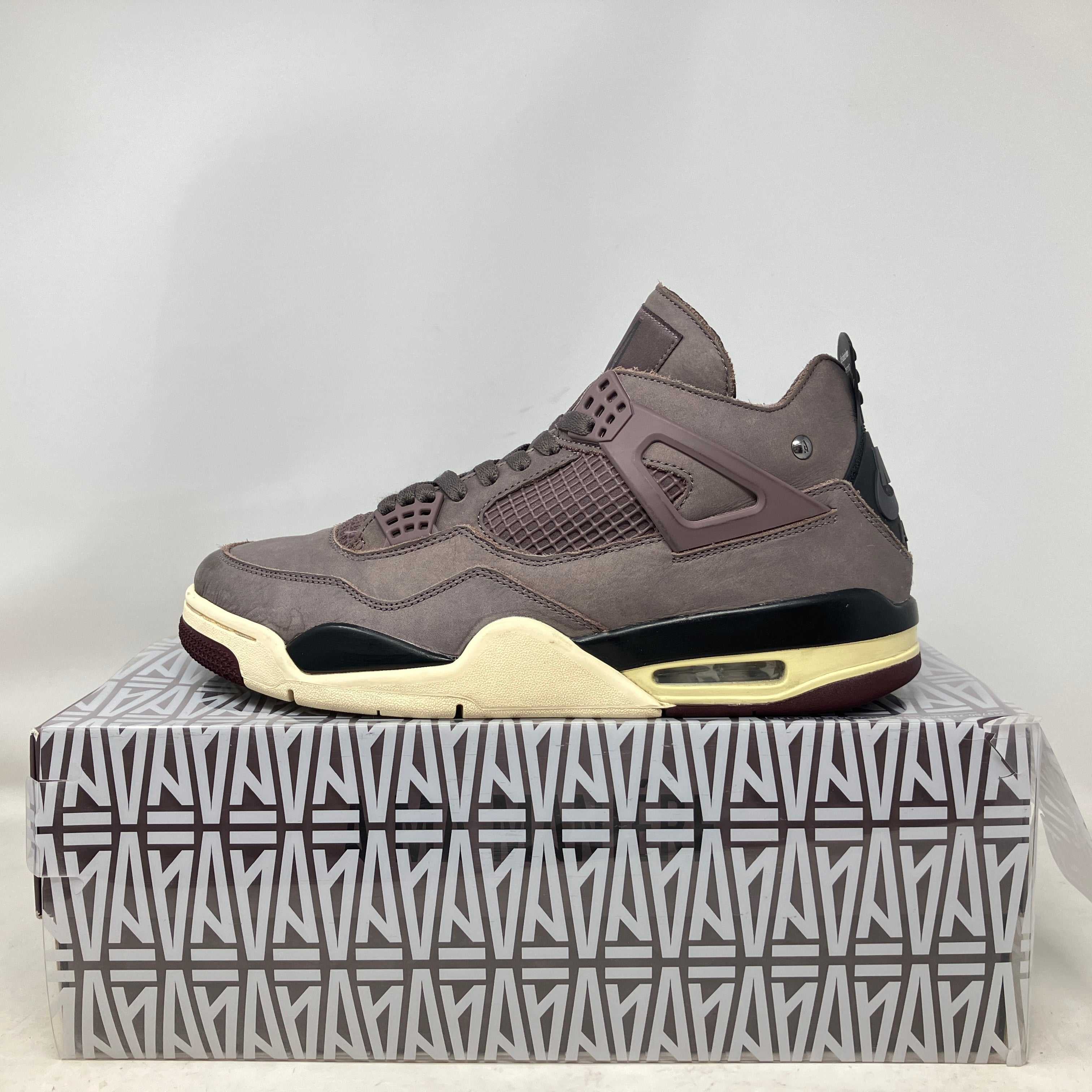 Jordan 4 Retro SP A Ma Maniére Violet Ore sneaker on patterned box, pre-owned with accessories included