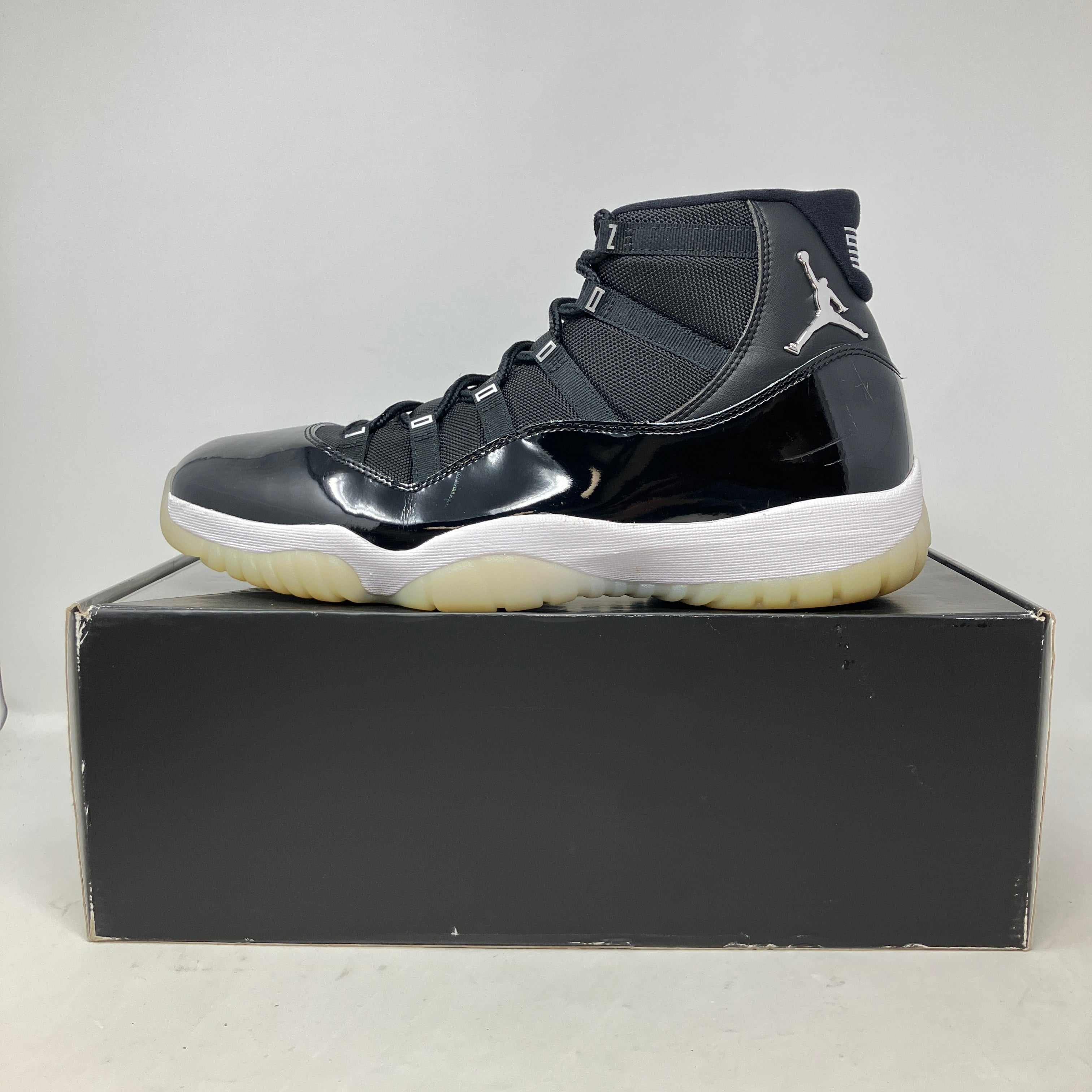 Pre owned Jordan 11 Retro Jubilee 25th Anniversary sneaker in black and white on box with all accessories included