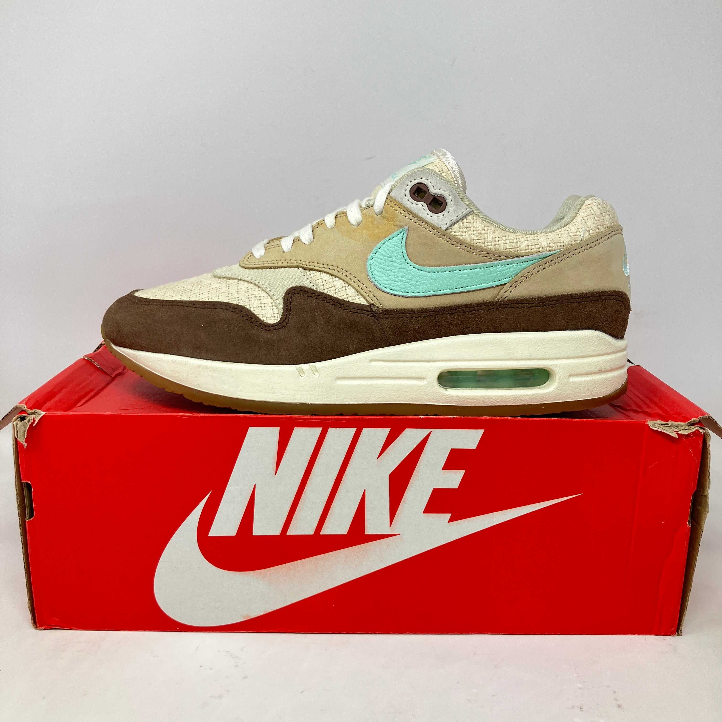 Nike Air Max 1 Crepe Brown 2022 sneaker on red Nike box, pre-owned condition with accessories included