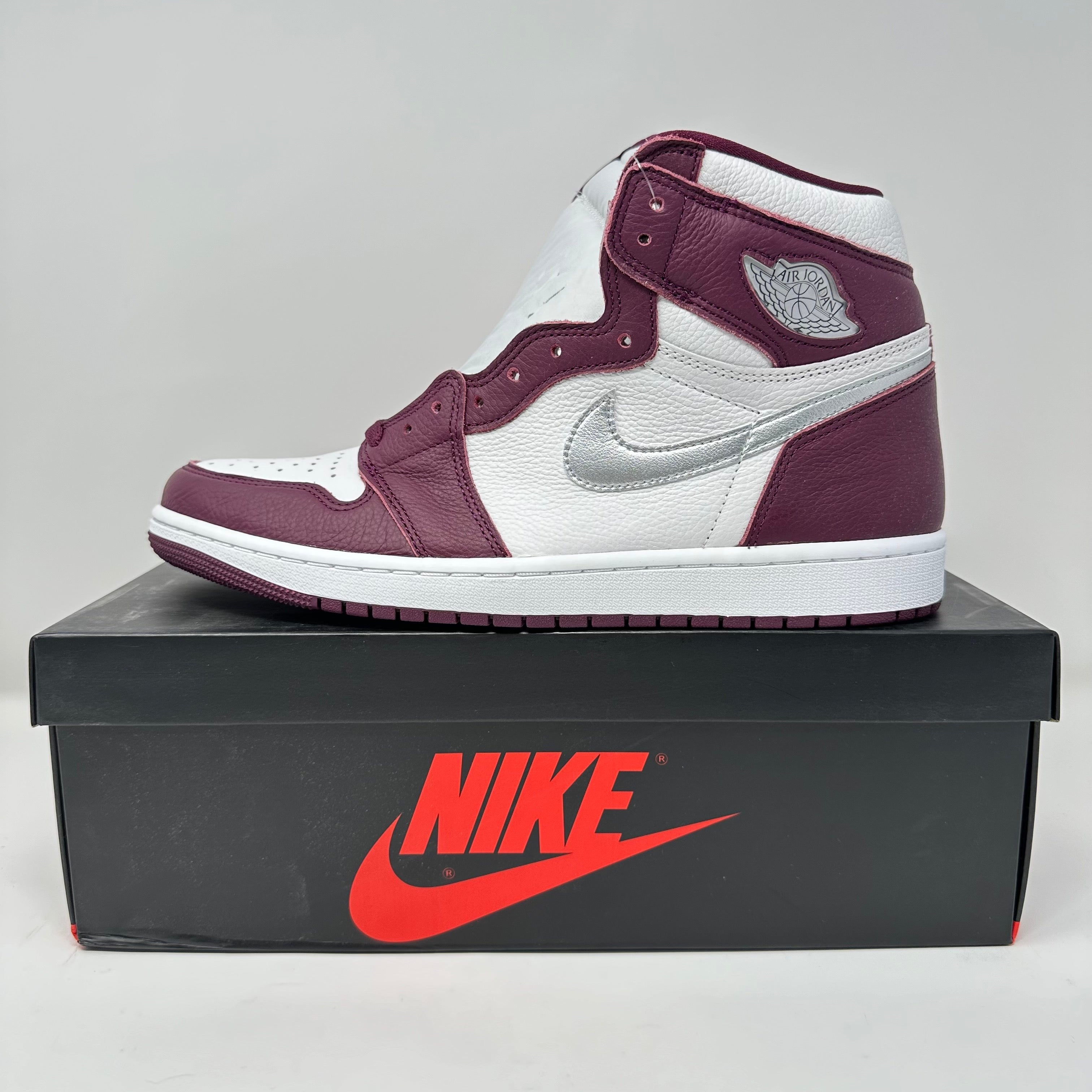 Jordan 1 Retro High OG Bordeaux sneaker in white and burgundy on black Nike box