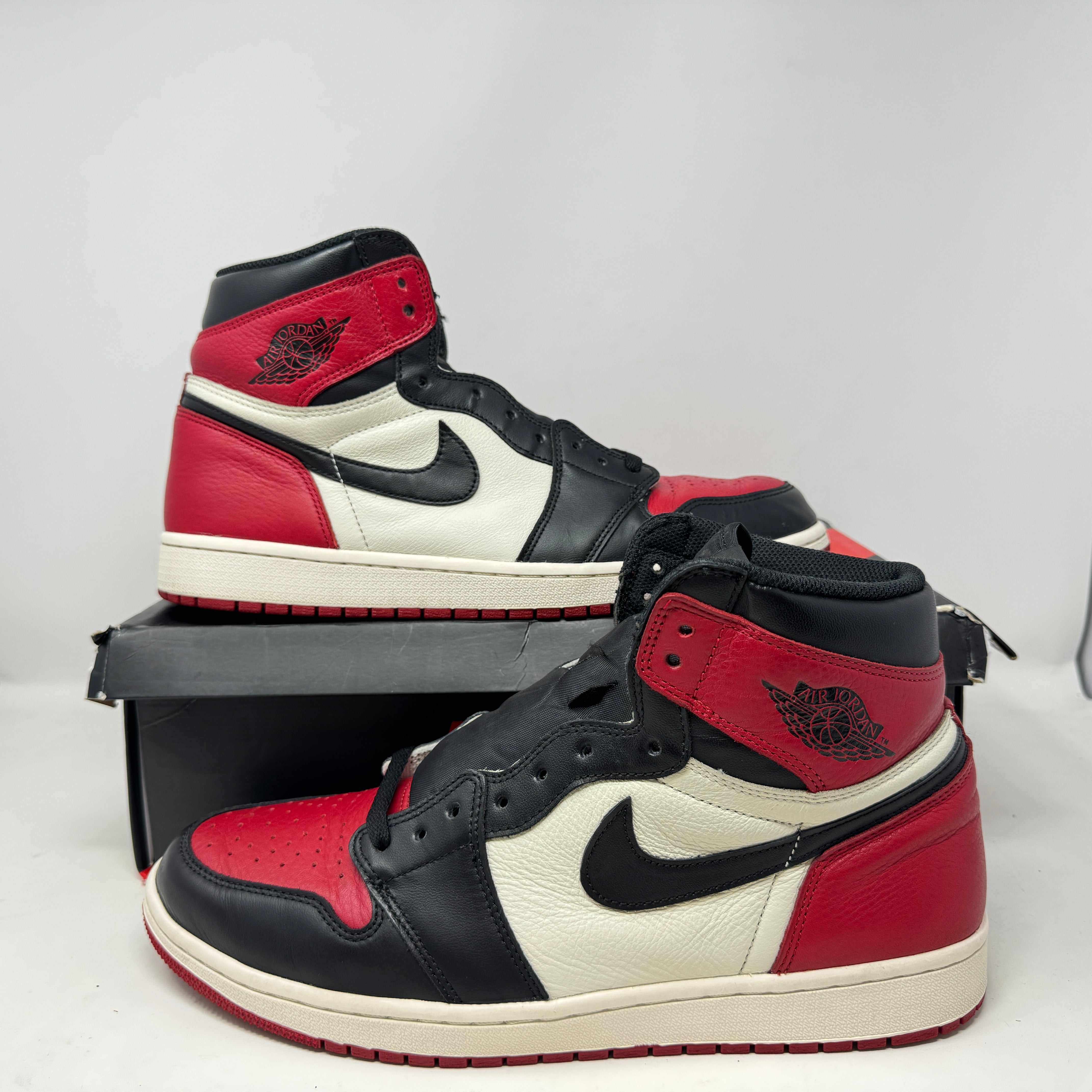 Jordan 1 Retro High Bred Toe sneakers, preowned condition, accessories included.