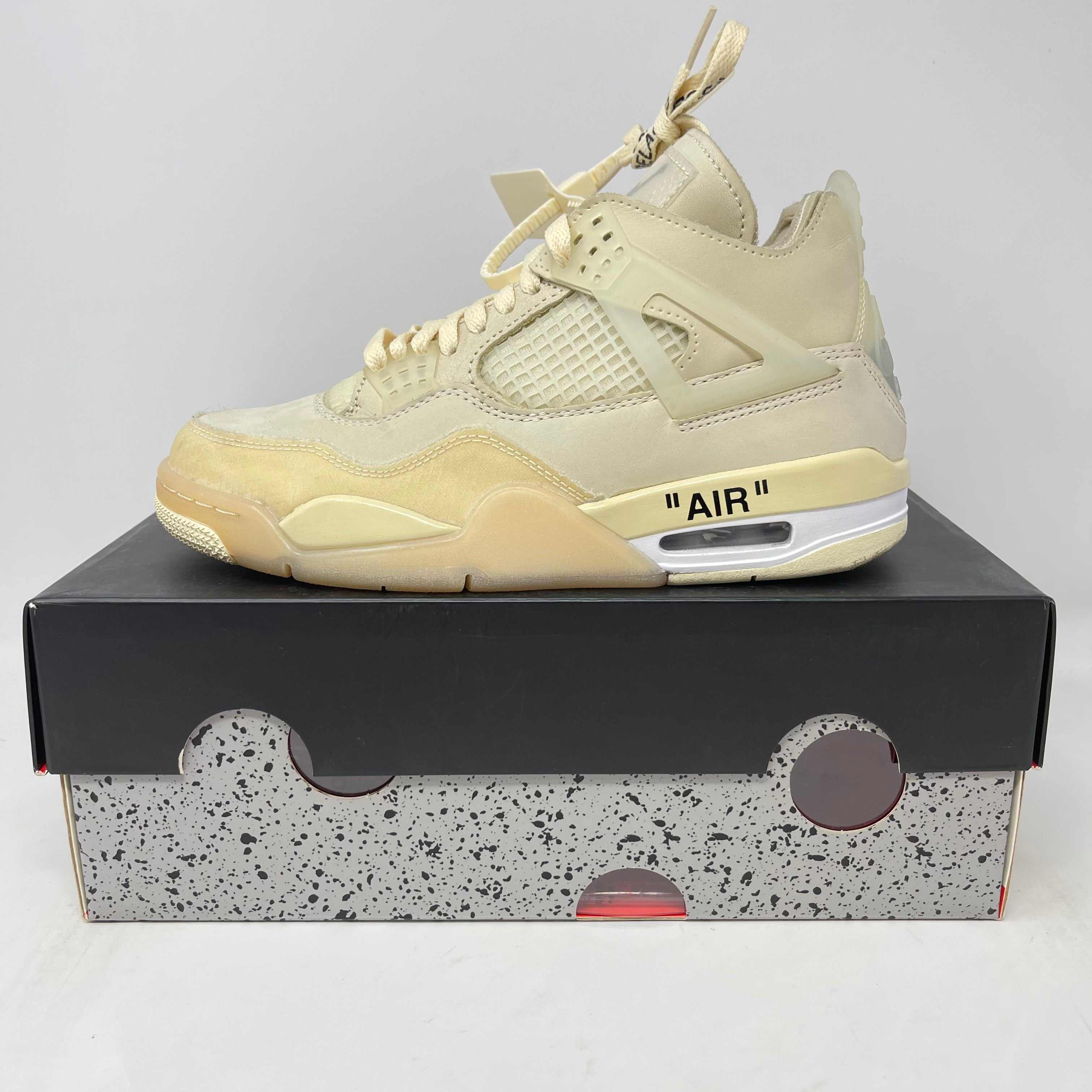 Jordan 4 Retro Off-White Sail sneaker in pre-owned condition on original box with all accessories included