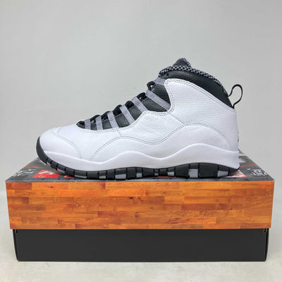 Side view of brand new Jordan 10 Retro OG Steel sneaker on shoebox with full accessories included