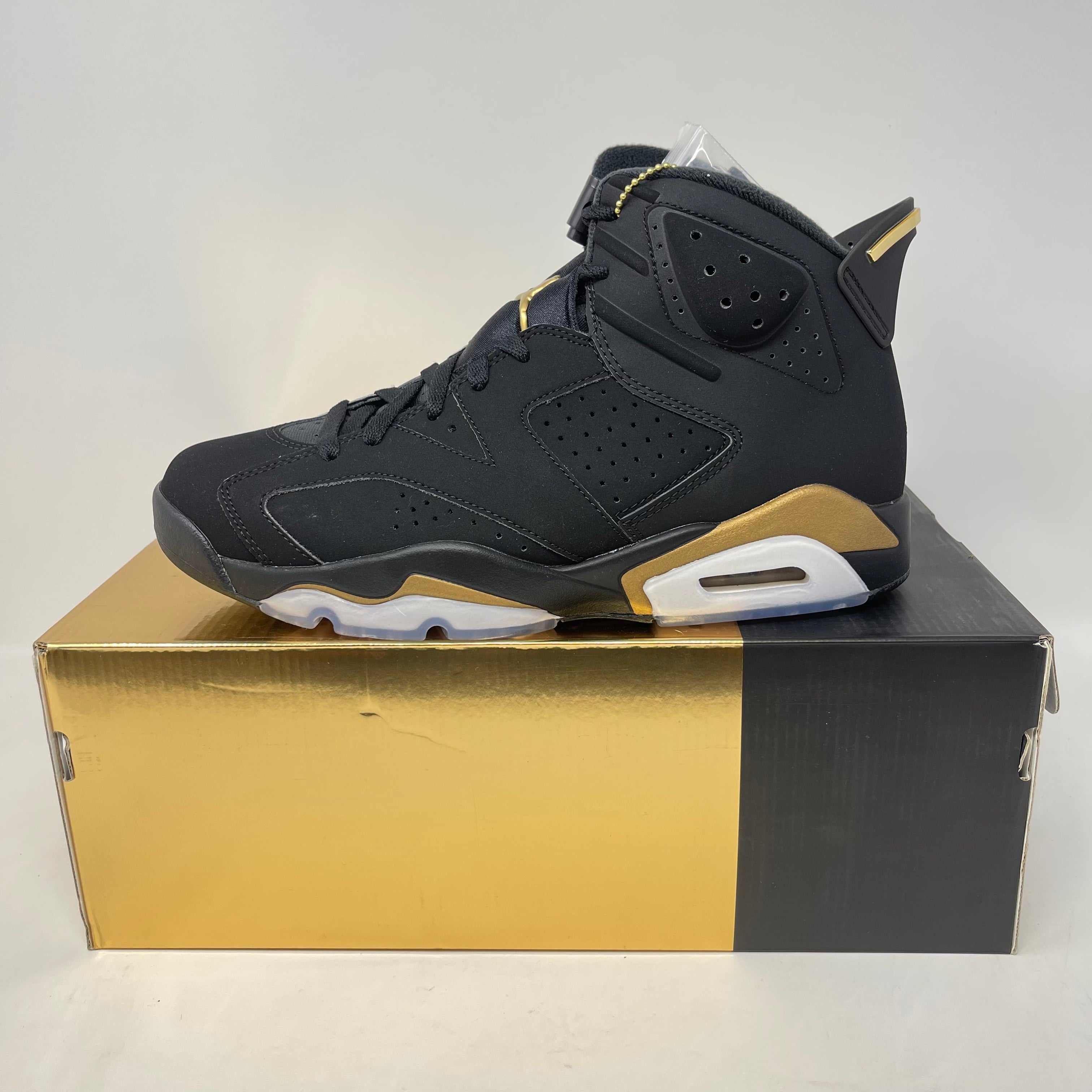 Jordan 6 Retro DMP 2020 black and gold sneaker on matching box, brand new with all accessories included