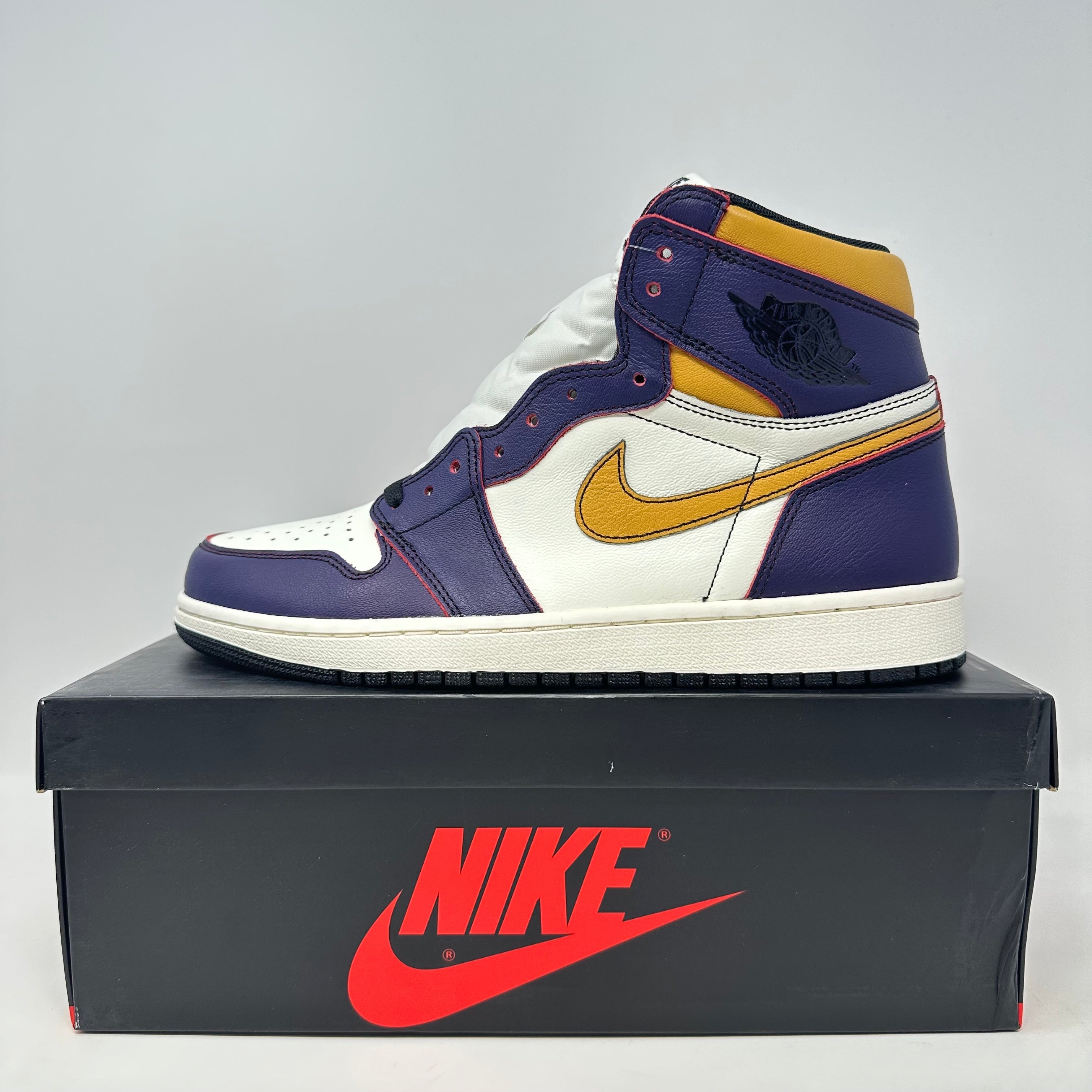 Jordan 1 Retro High OG Defiant SB LA to Chicago sneaker in purple, white, and yellow on Nike box, brand new with all accessories