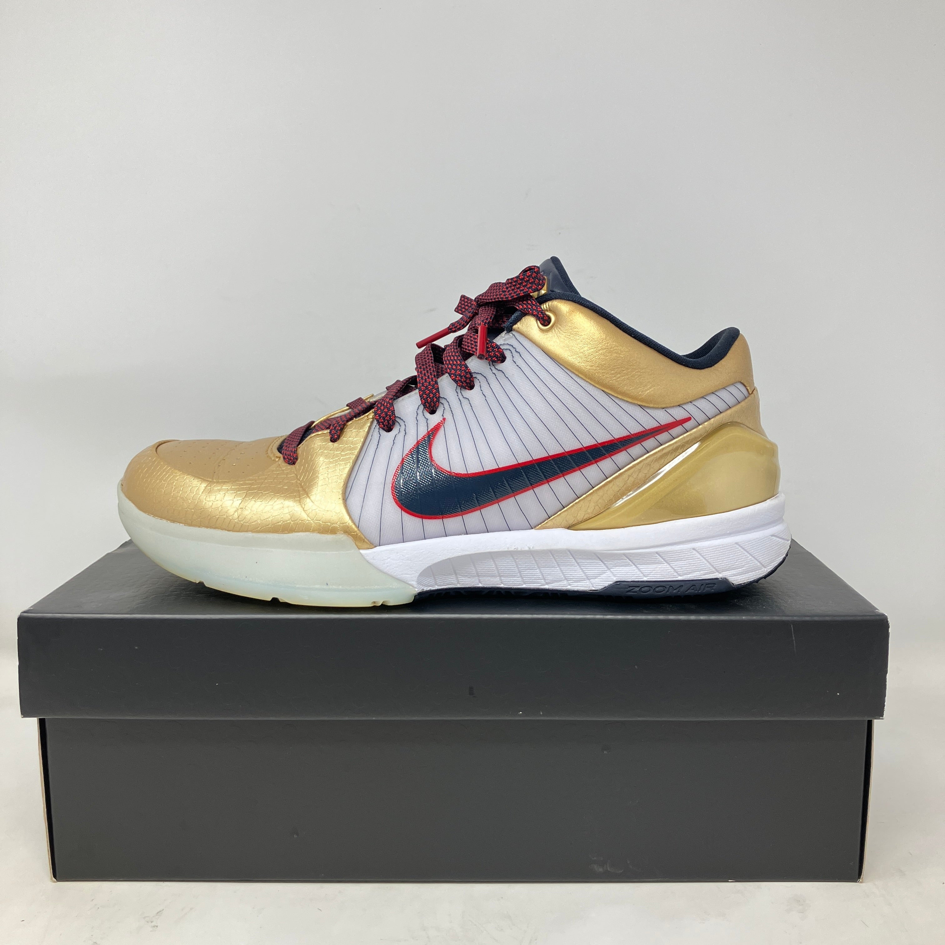 Nike Kobe 4 Protro Gold Medal 2024 basketball shoe in gold and white on black box, pre-owned with accessories included