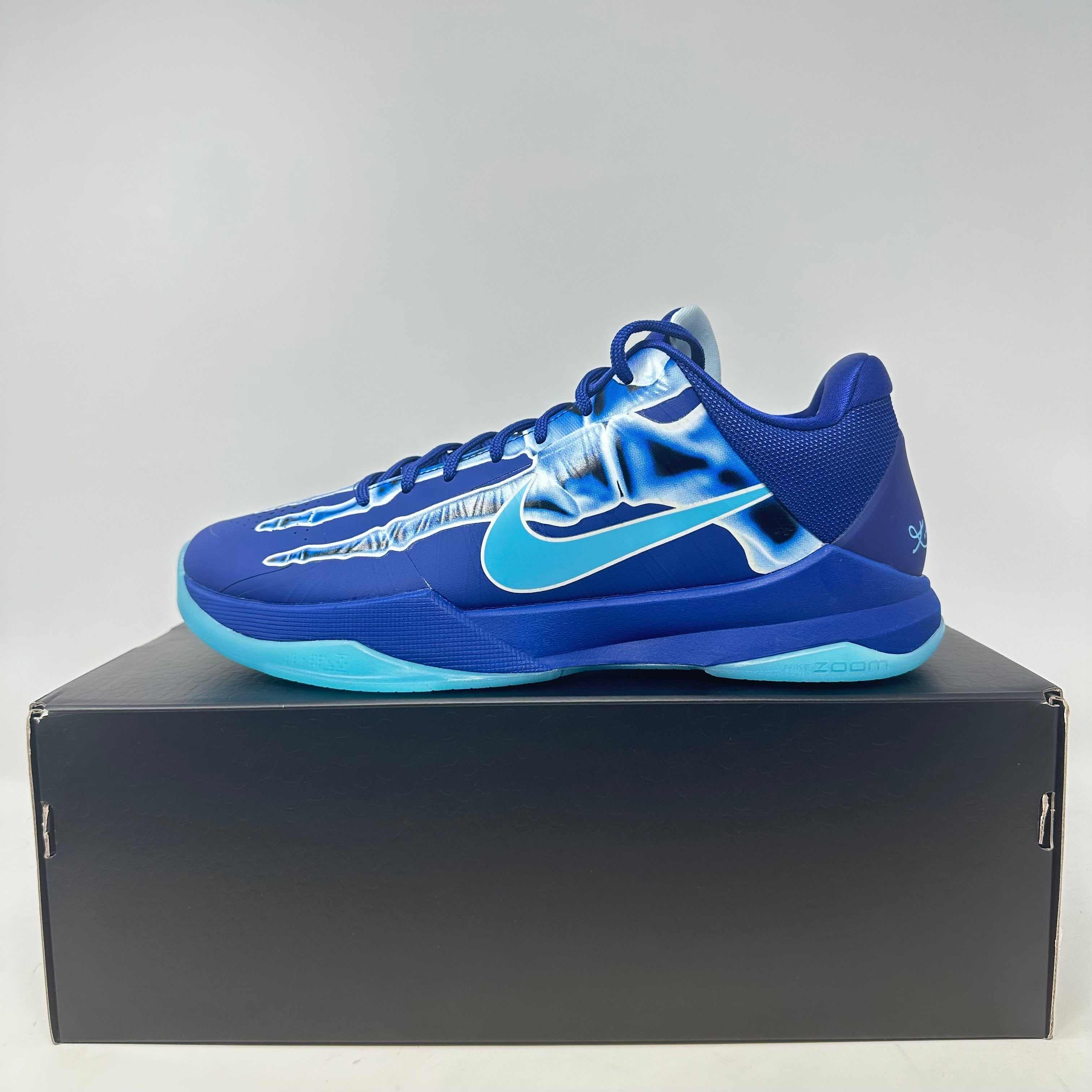 Nike Kobe 5 Protro X-Ray basketball shoe in blue with x-ray design on black box, brand new with accessories included