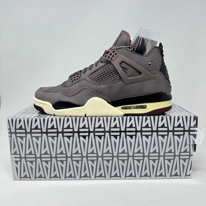 Jordan 4 Retro A Ma Maniére Violet Ore sneaker in brand new condition with complete accessories displayed on branded box