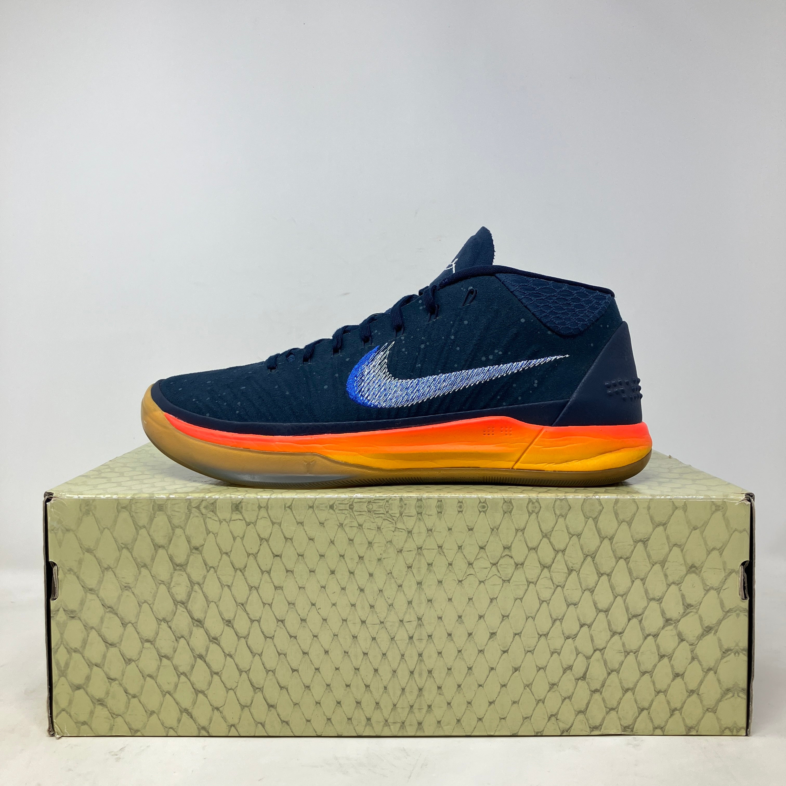 Nike Kobe A.D. Mid Rise basketball shoe in navy with orange sole, pre-owned with all accessories on patterned box