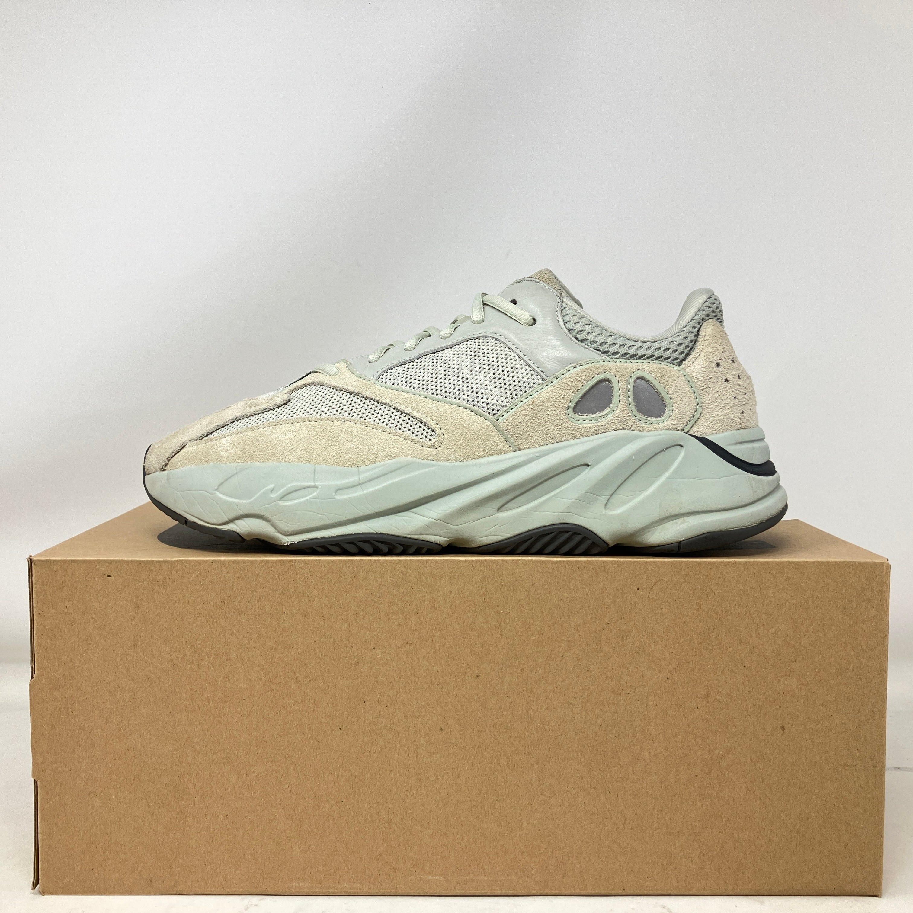 Side view of pre-owned adidas Yeezy Boost 700 Salt sneaker on box with all accessories included