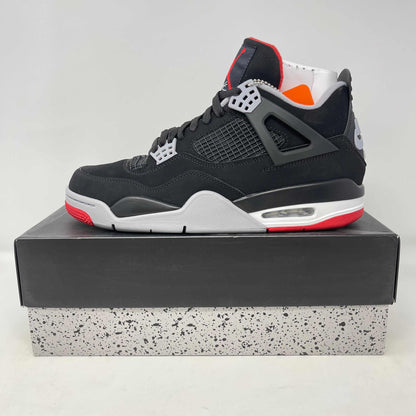 Jordan 4 Retro Bred (2019) sneaker, brand new condition, displayed on a box.