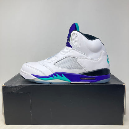 White and purple Jordan 5 Retro Grape sneaker on black box, brand new condition