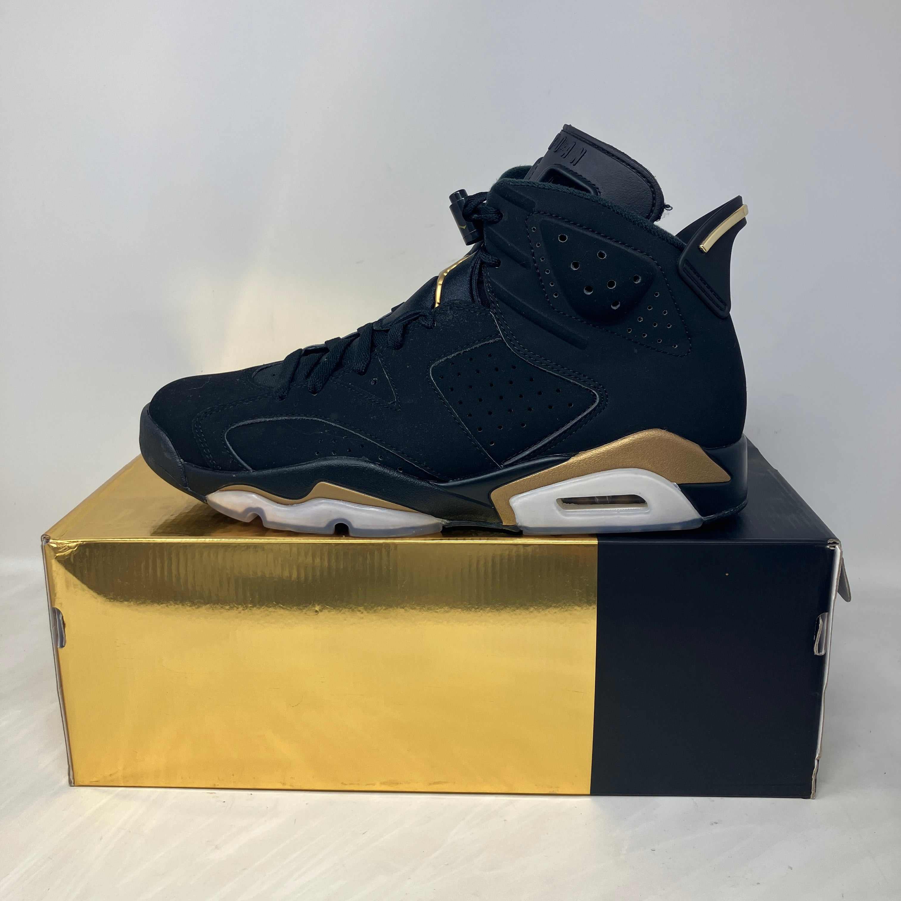 Jordan 6 Retro DMP 2020 black and gold sneaker on box, preowned with accessories included