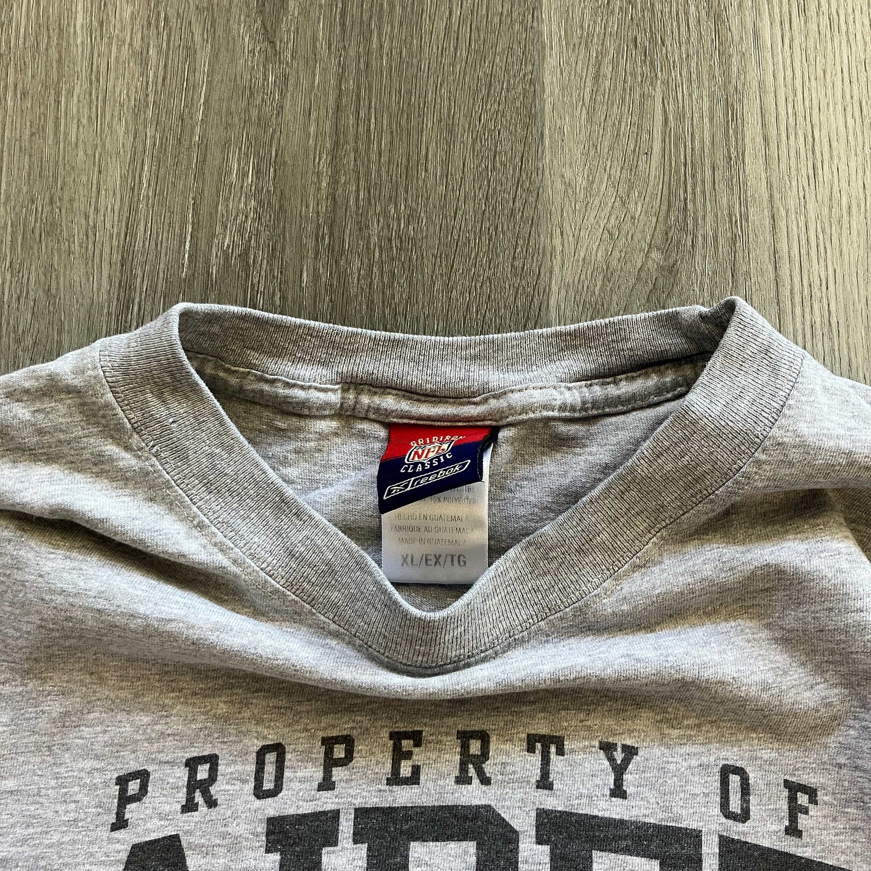 Vintage Property of Raiders tee, pre-owned, all accessories included.