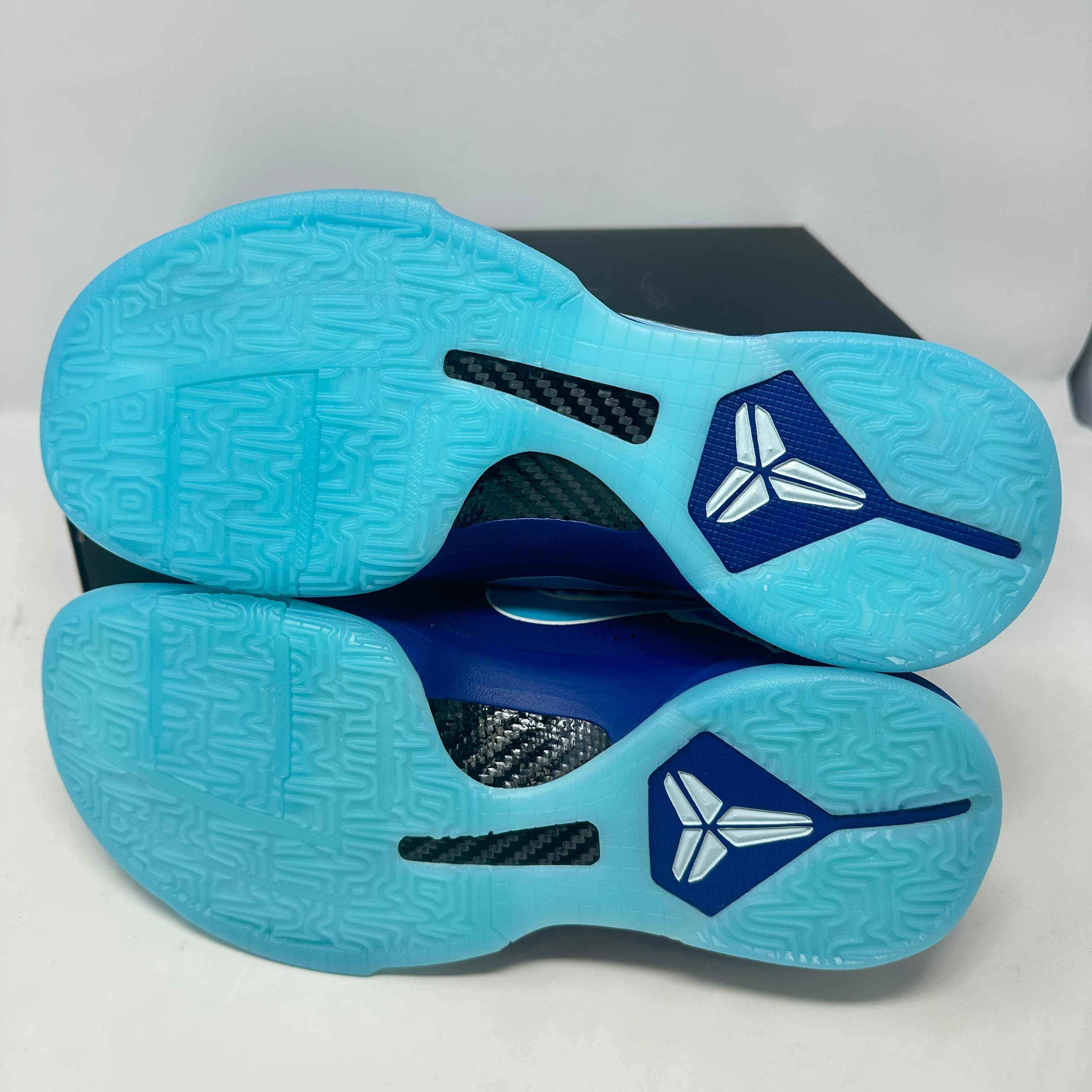 Brand new Nike Kobe 5 Protro X-Ray sneakers with blue soles and original accessories.