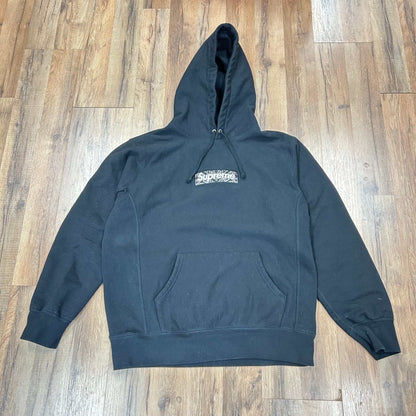 Supreme Bandana Box Logo black hooded sweatshirt with front pocket on wooden floor