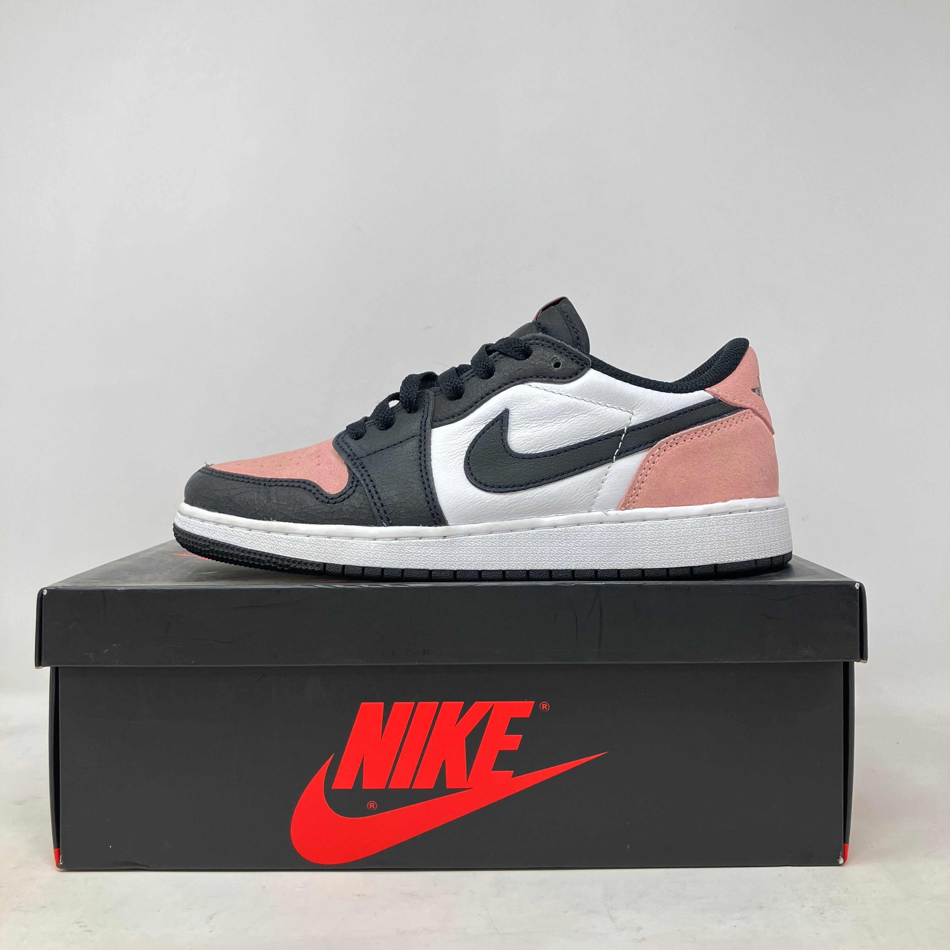 Jordan 1 Low OG Bleached Coral sneaker in black, white, and coral colorway on Nike box, pre-owned with accessories included