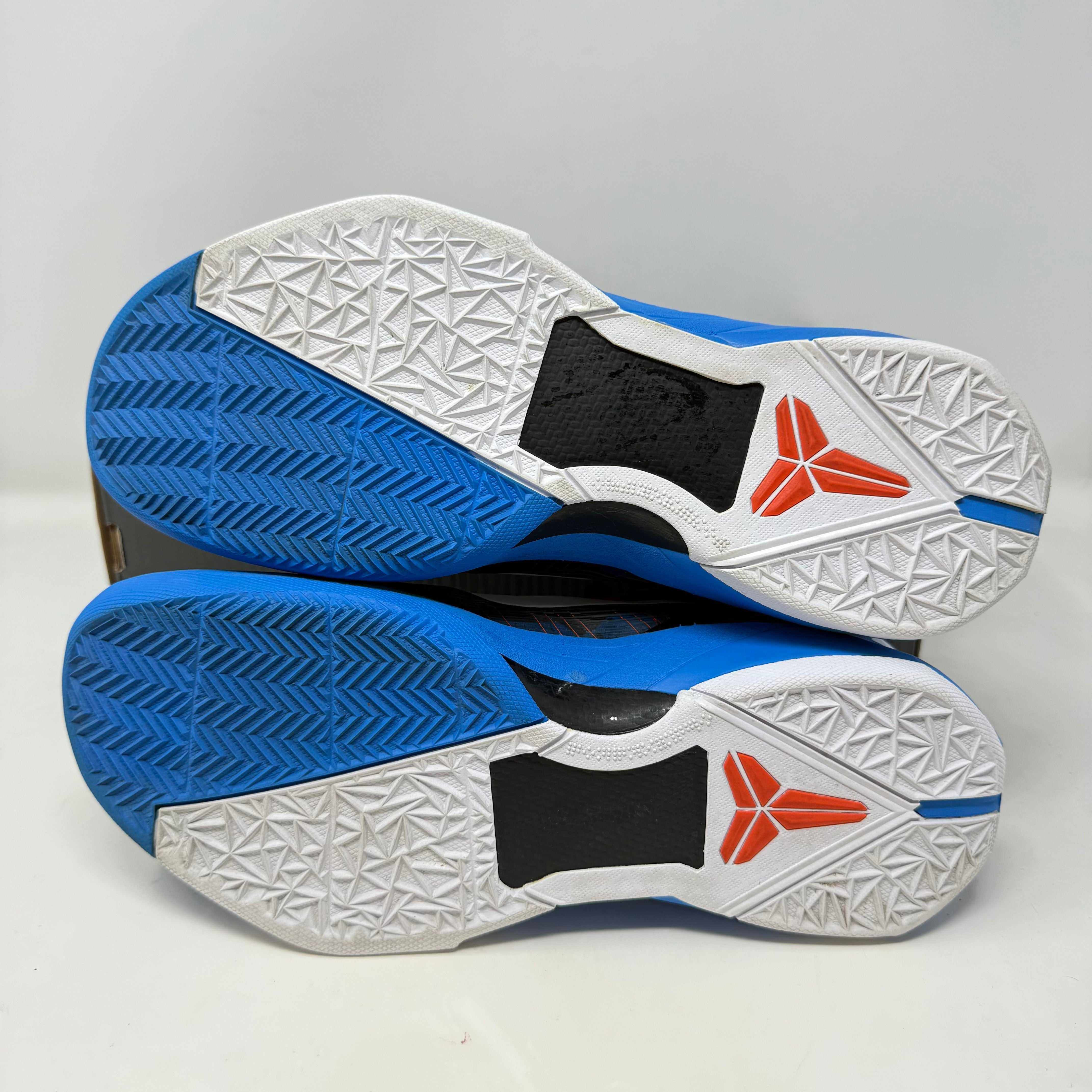 Nike Kobe 7 Poison Dart Frog Blue sneakers, pre-owned with full accessories, view of soles.