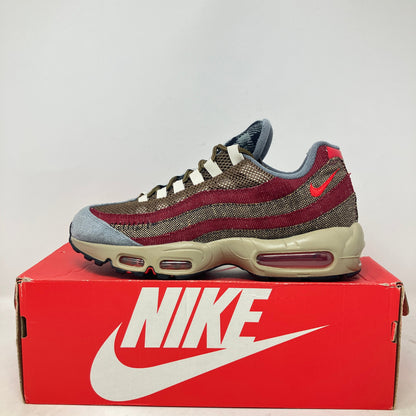 Nike Air Max 95 Freddy Krueger sneaker in red and brown tones on red Nike box, pre-owned with all accessories included