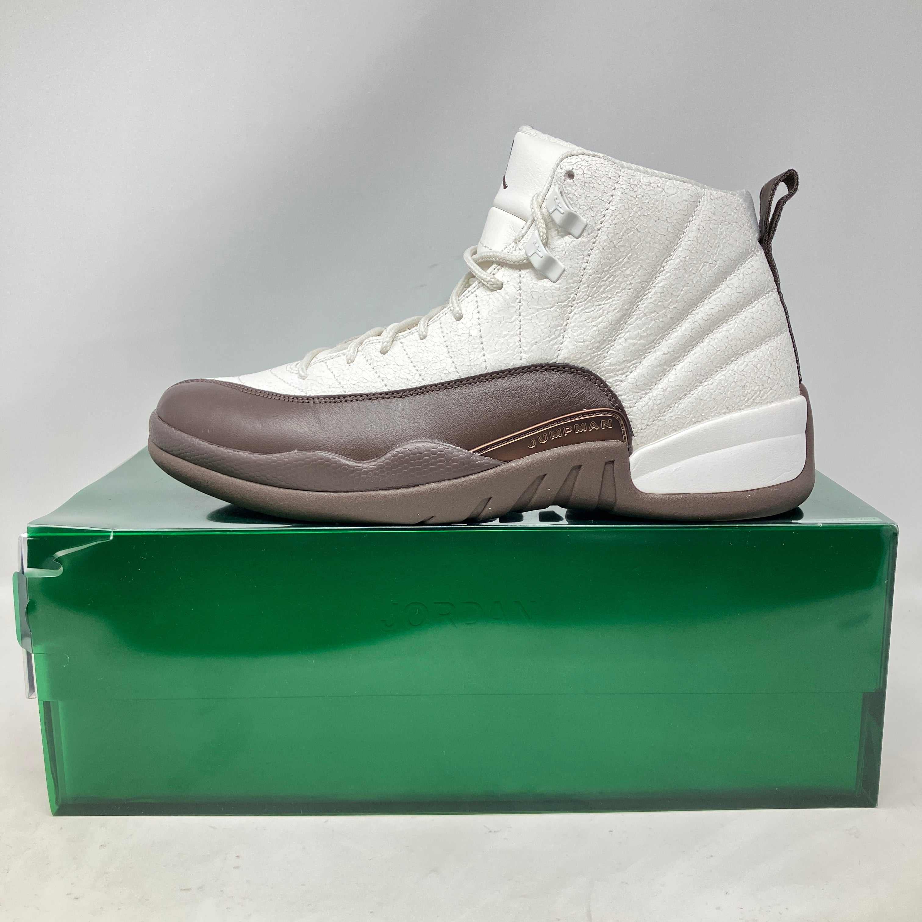 Jordan 12 Retro SP SoleFly Cafecito white and brown sneaker on green box preowned with accessories