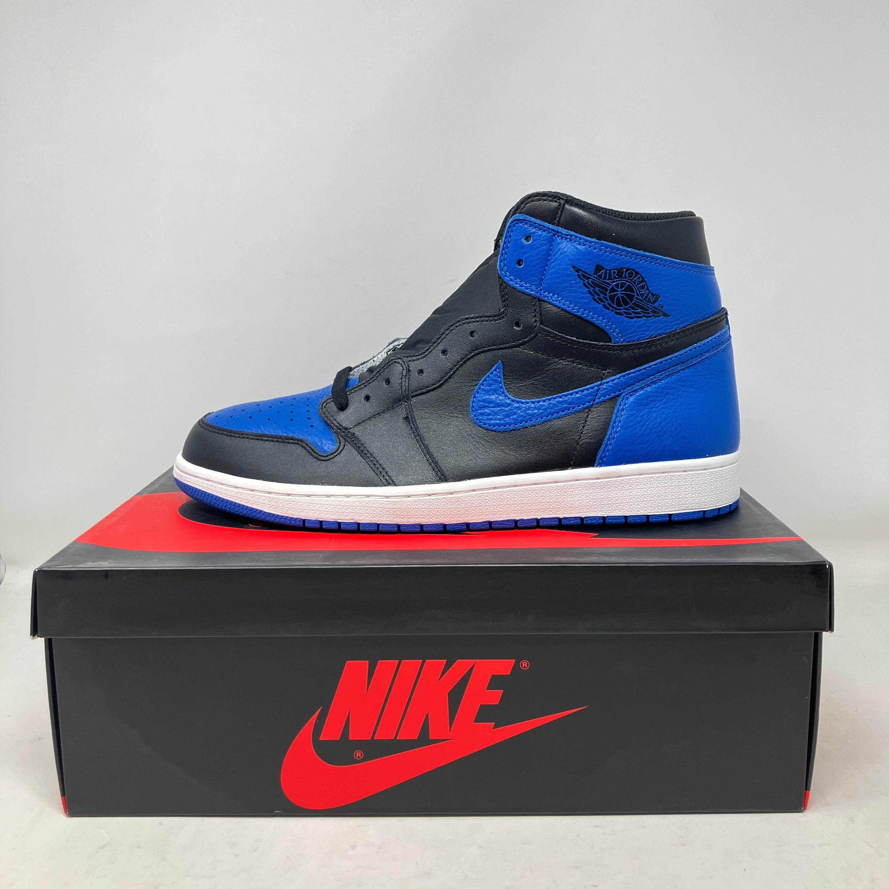 Jordan 1 Retro Royal 2017 black and blue sneaker on Nike box, brand new with accessories included