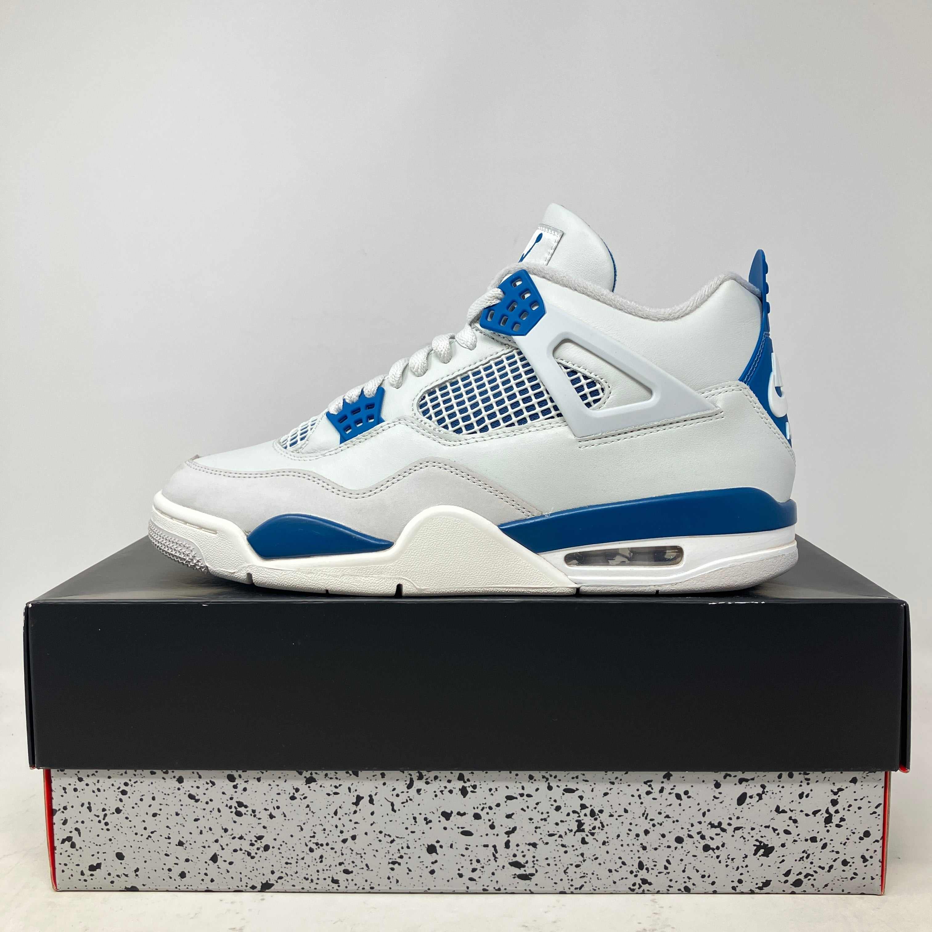 Jordan 4 Retro Military Blue sneaker in white and blue on box, pre owned with all accessories included