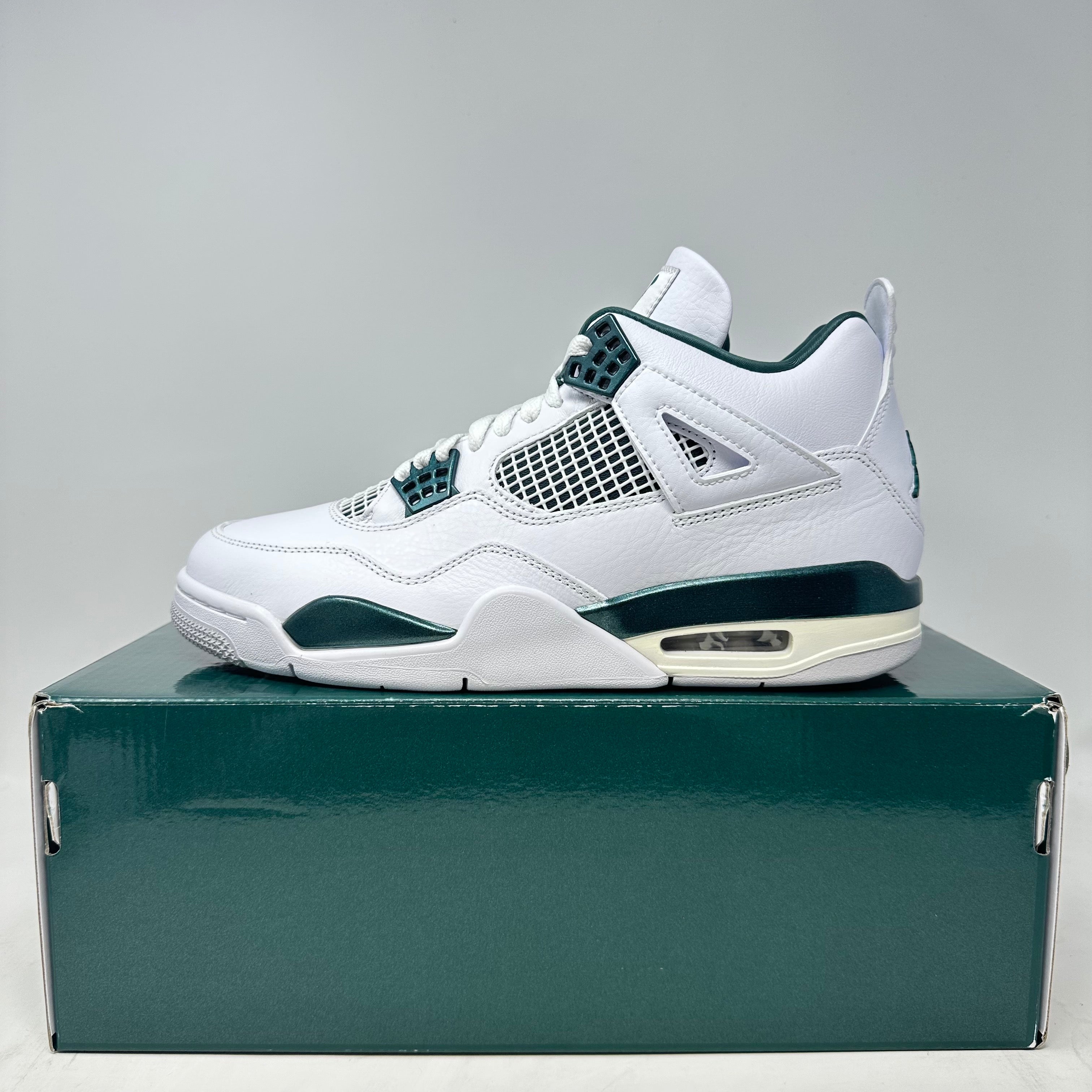 Jordan 4 Retro Oxidized Green sneaker on box, brand new condition.