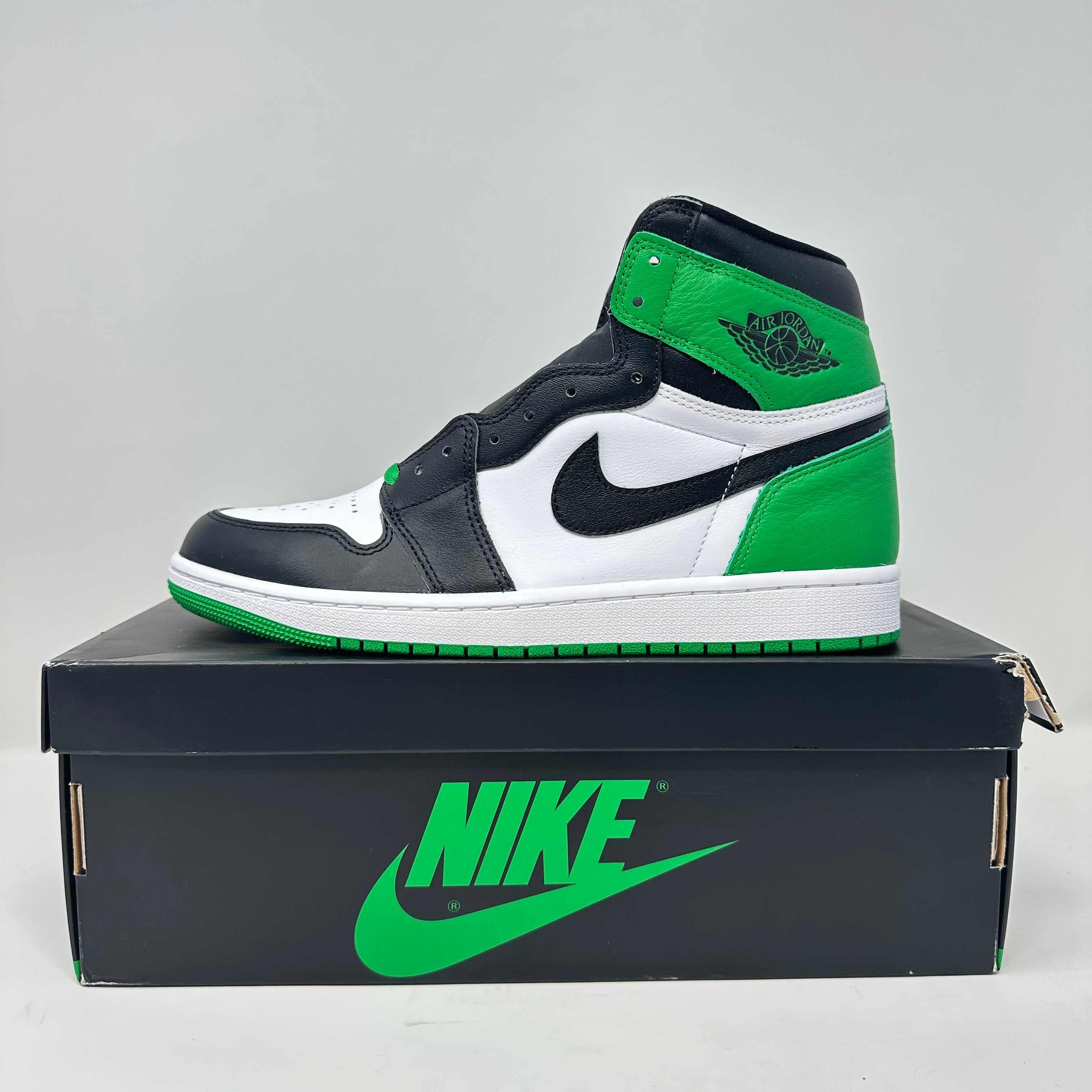 Jordan 1 Retro High OG Lucky Green sneaker in black, white, and green on Nike shoebox, brand new with accessories included