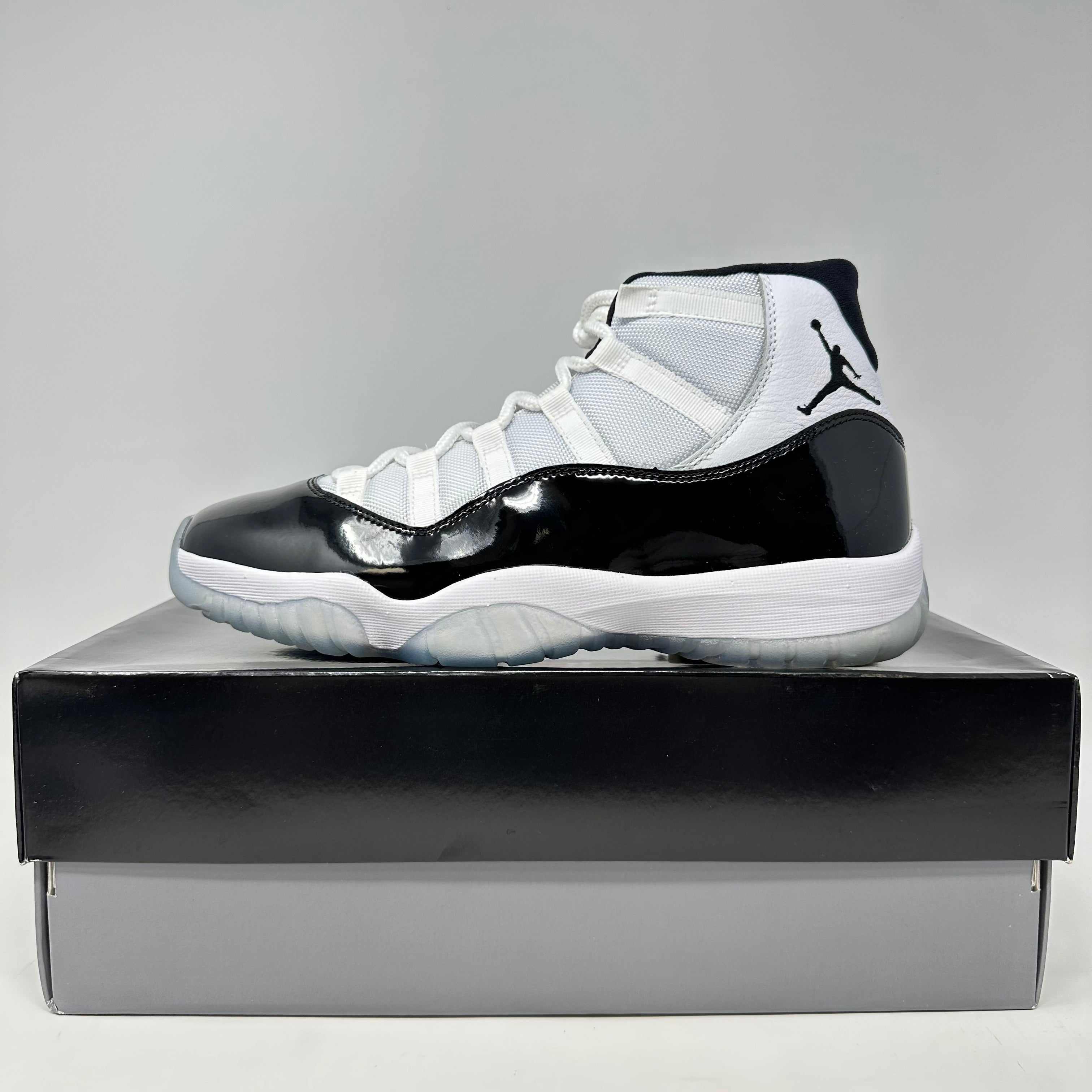 Jordan 11 Retro Concord 2018 sneaker in white and black on shoebox, brand new with accessories included