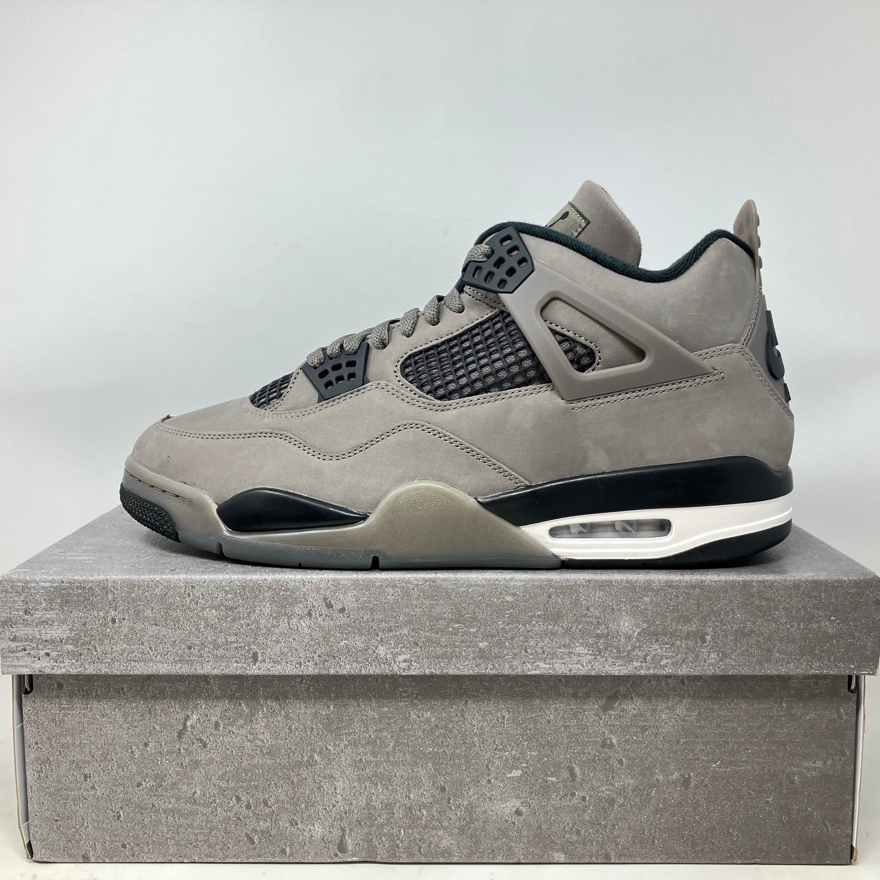 Jordan 4 Retro Cave Stone sneaker in brand new condition on matching stone gray box.