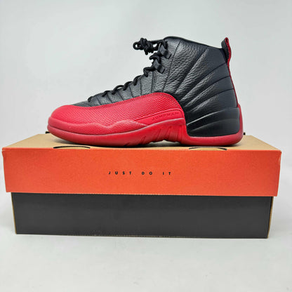 Jordan 12 Retro Flu Game 2025 sneaker in black and red on box with label Just Do It