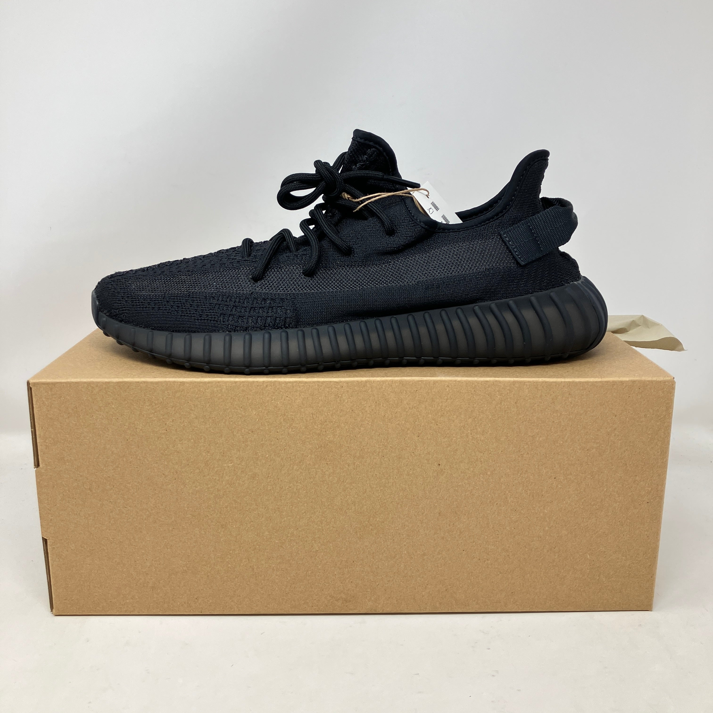 adidas Yeezy Boost 350 V2 Onyx sneaker, brand new with all accessories, displayed on box.